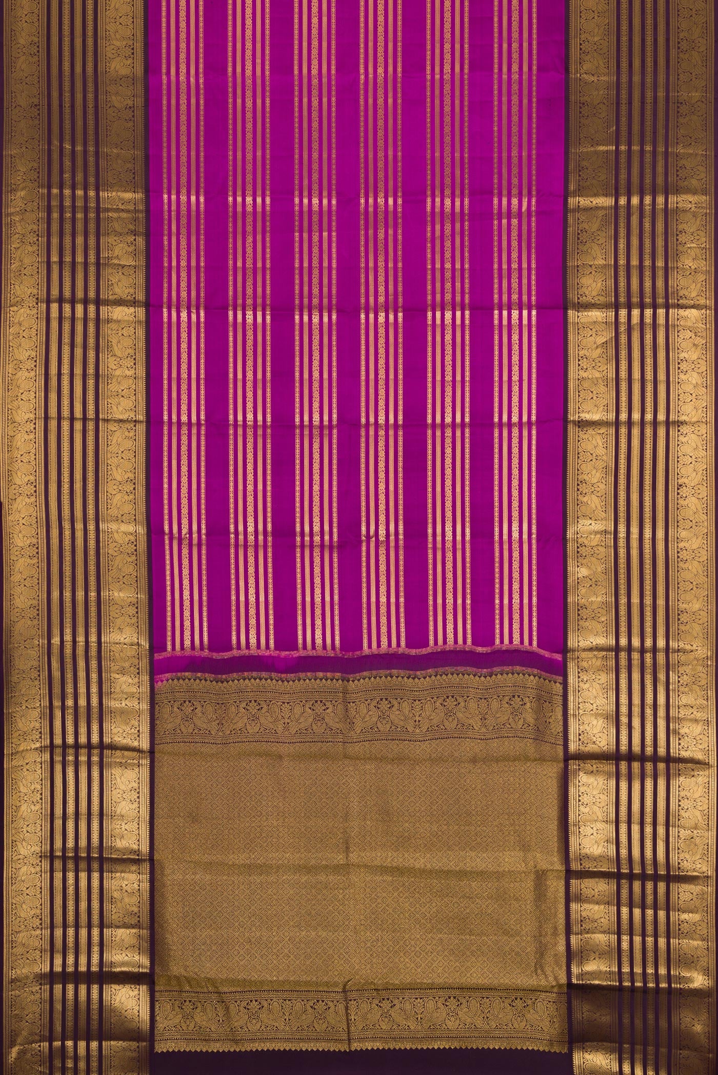 Flat view of Magenta Kanjivaram Silk Saree with Stripes on the body and Zari Border. 