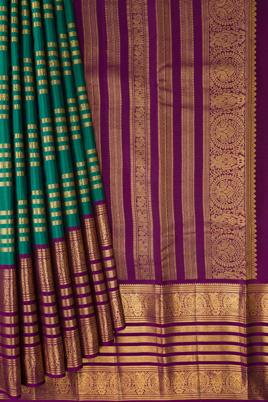 Pleats and pallu of Green Kanjivaram Silk Saree with Stripes on the body and Zari Border. 