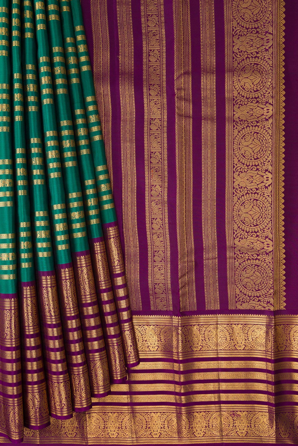 Pleats and pallu of Green Kanjivaram Silk Saree with Stripes on the body and Zari Border. 