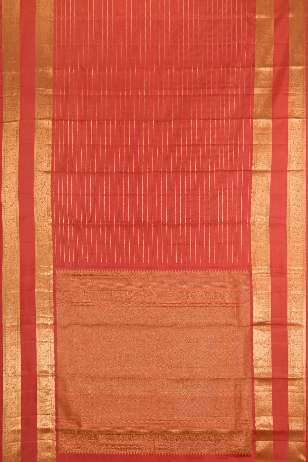 Flat view of Brick Orange Kanjivaram Silk Saree with Stripes on the body and Zari Border. 