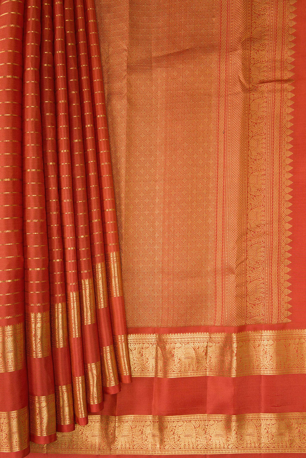 Pleats and pallu of Brick Orange Kanjivaram Silk Saree with Stripes on the body and Zari Border. 