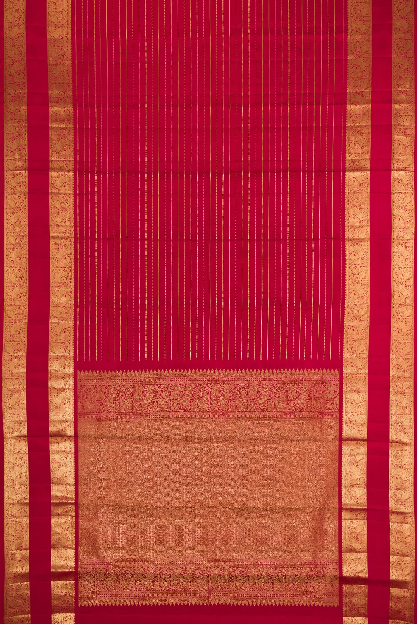 Flat view of Maroon Kanjivaram Silk Saree with Stripes on the body and Zari Border. 