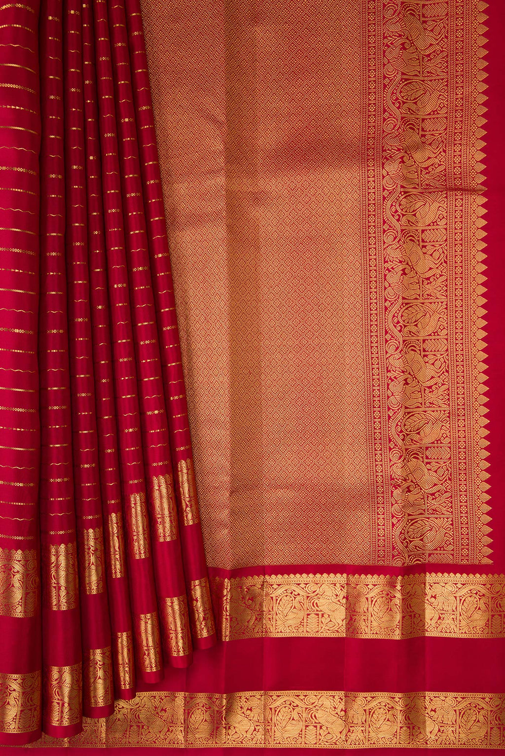 Pleats and pallu of Maroon Kanjivaram Silk Saree with Stripes on the body and Zari Border. 