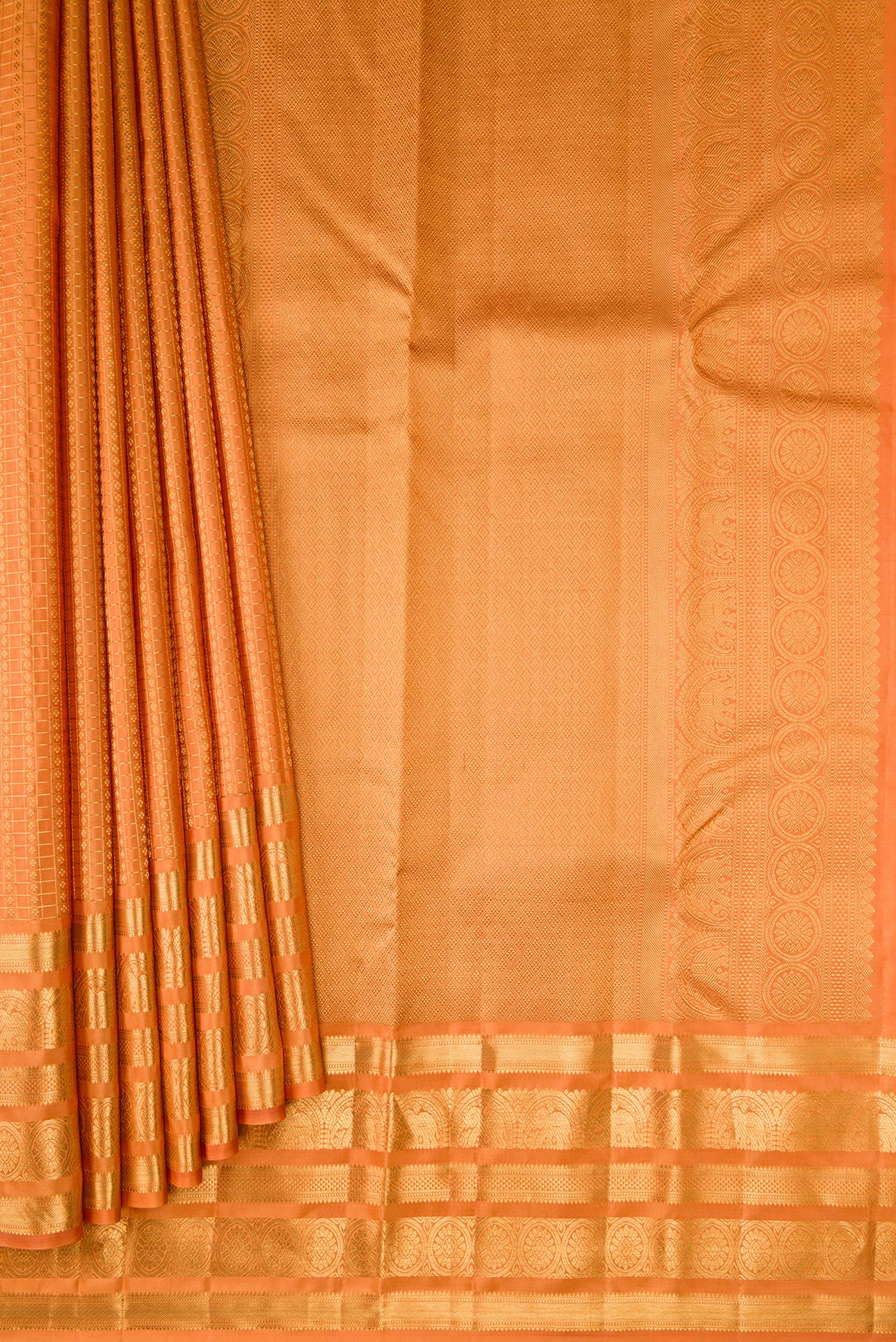Pleats and pallu of Orange Kanjivaram Silk Saree with Zari Brocade on the body and Zari Border. 