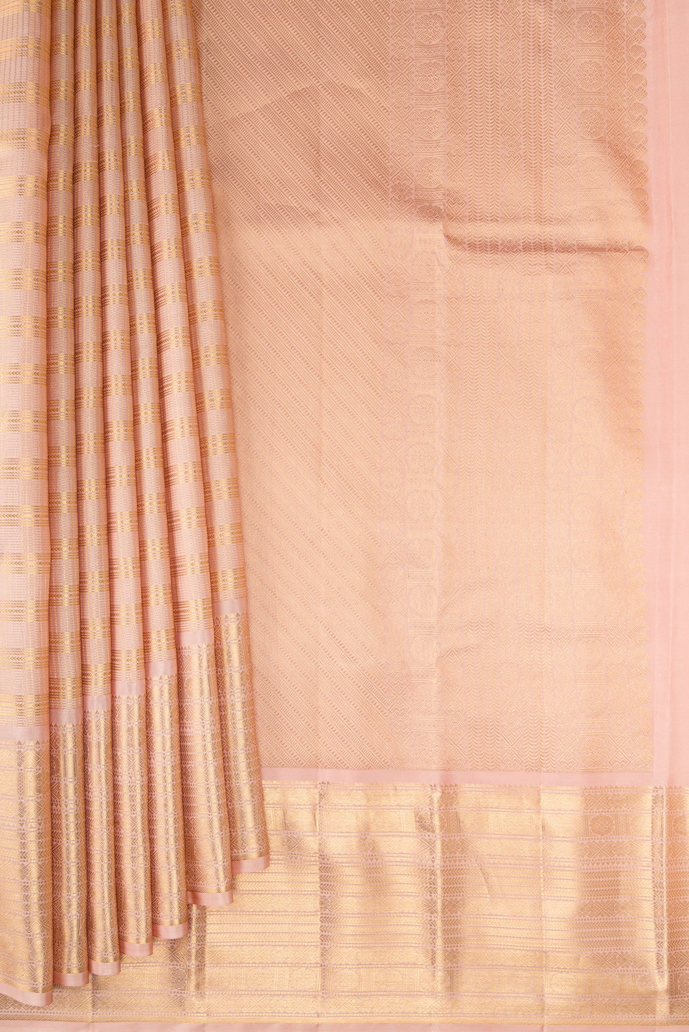 Pleats and pallu of Peach Kanjivaram Silk Saree with Checked design on the body and Zari Border. 