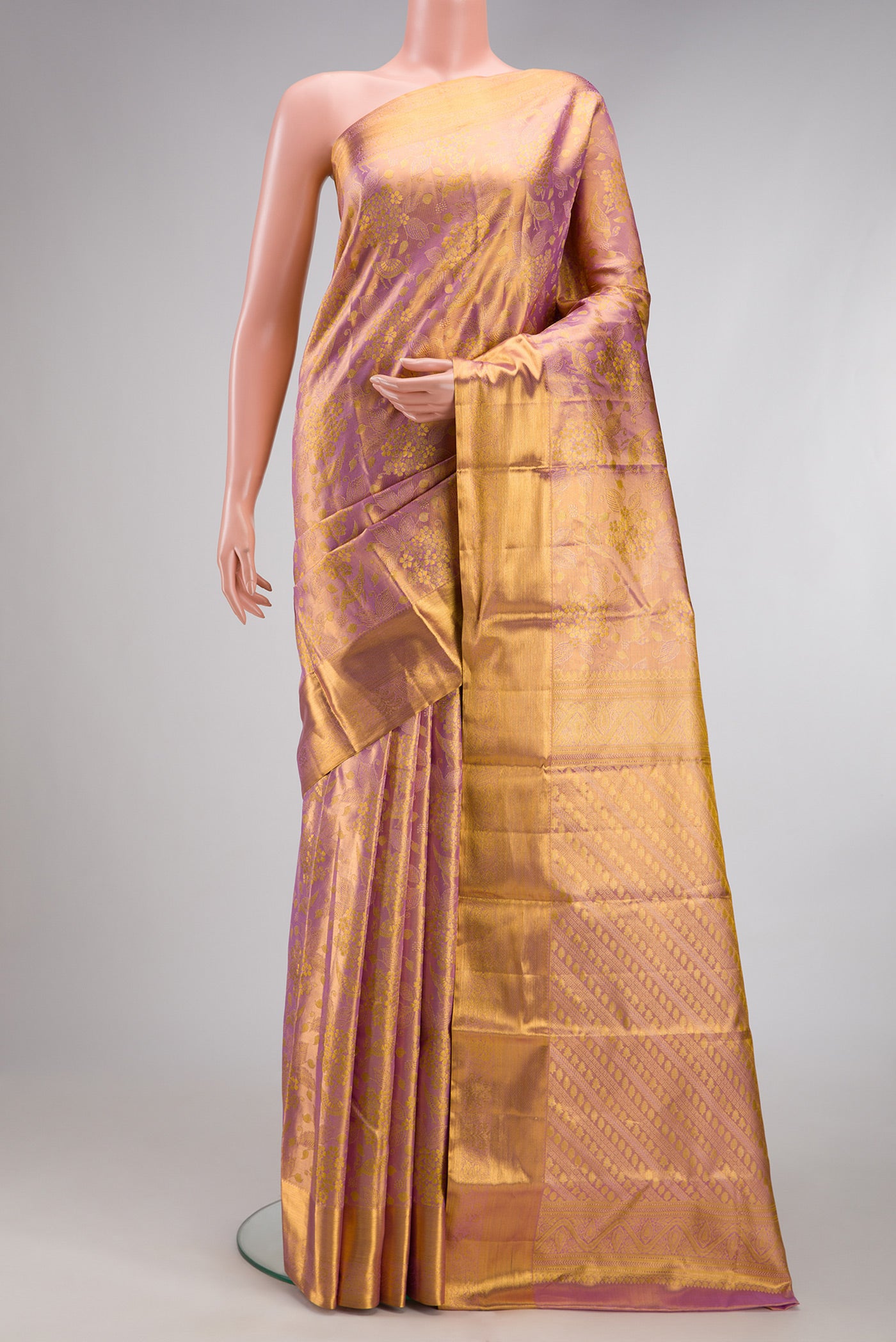 Rose Gold Dual Tone Kanchipuram Tissue Silk Saree with Zari Brocade on the body and Zari Border.  displayed on a mannequin