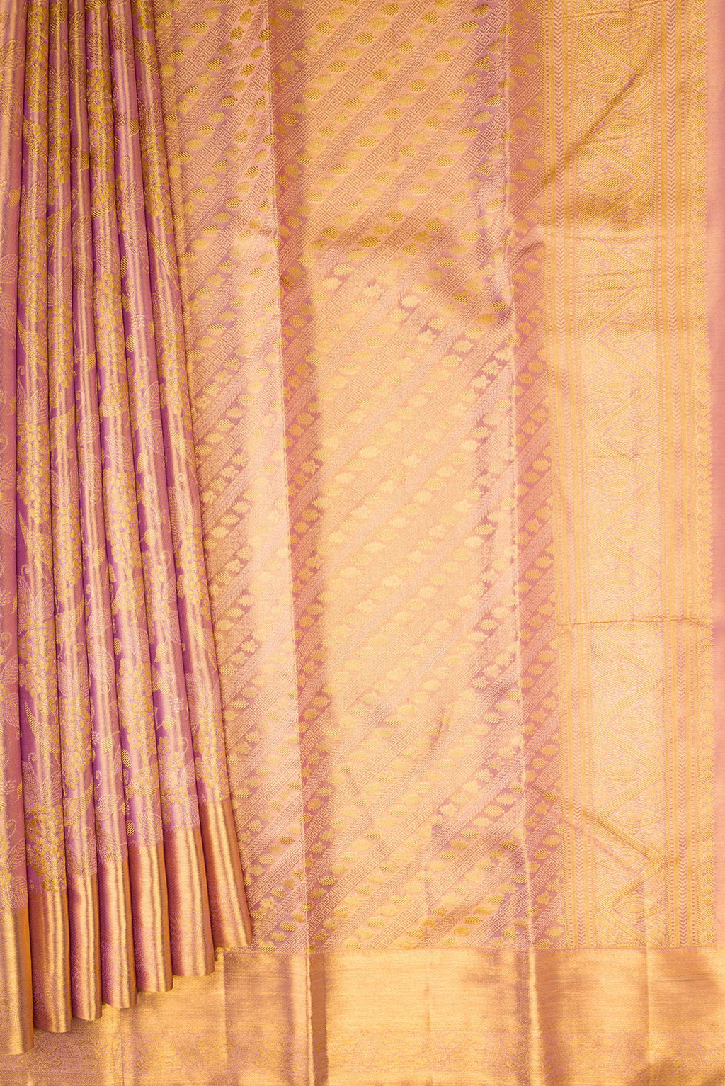 Pleats and pallu of Rose Gold Dual Tone Kanchipuram Tissue Silk Saree with Zari Brocade on the body and Zari Border. 