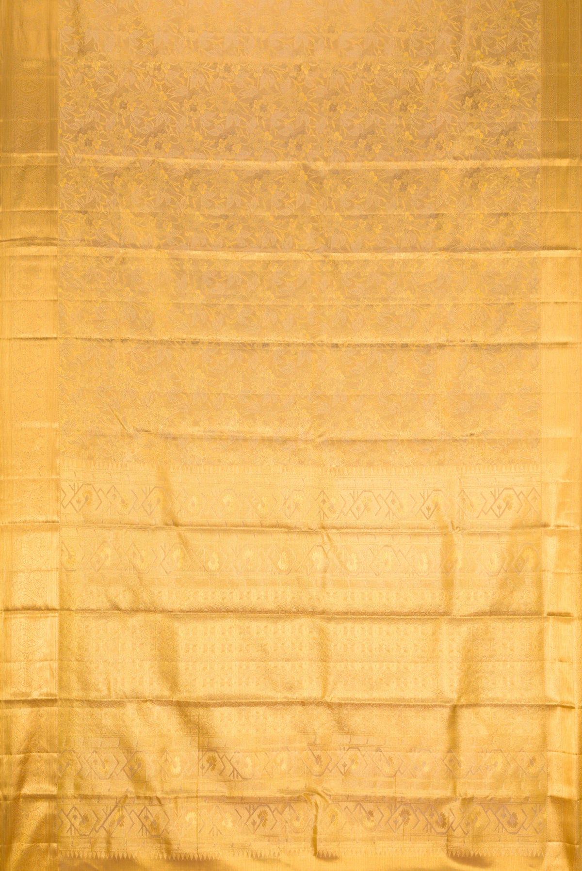 Flat view of Gold Dual Tone Kanchipuram Tissue Silk Saree with Zari Brocade on the body and Zari Border. 