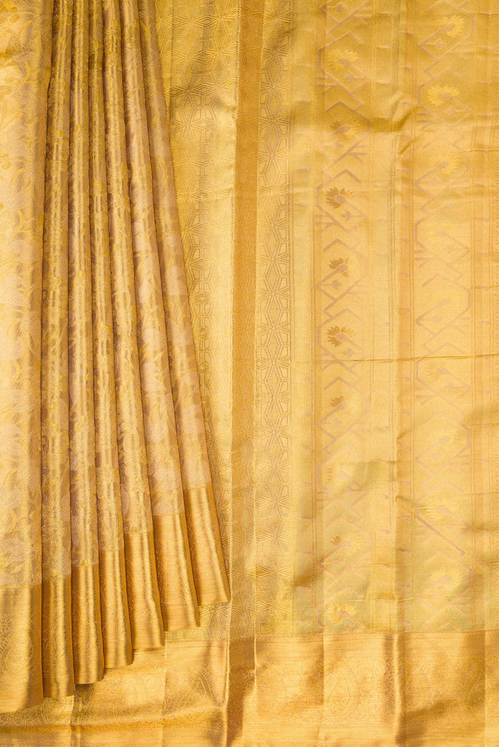 Pleats and pallu of Gold Dual Tone Kanchipuram Tissue Silk Saree with Zari Brocade on the body and Zari Border. 