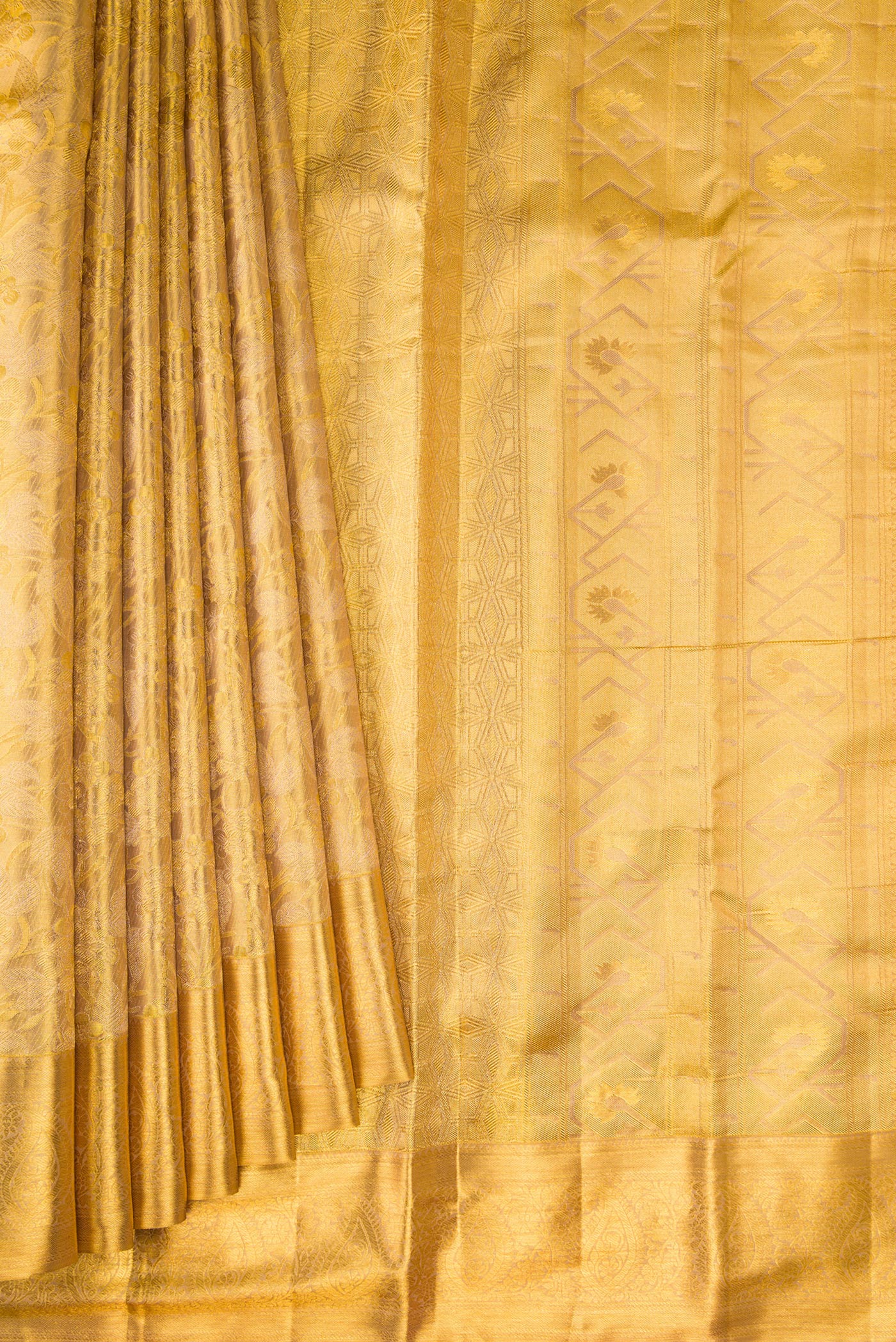 Pleats and pallu of Gold Dual Tone Kanchipuram Tissue Silk Saree with Zari Brocade on the body and Zari Border. 