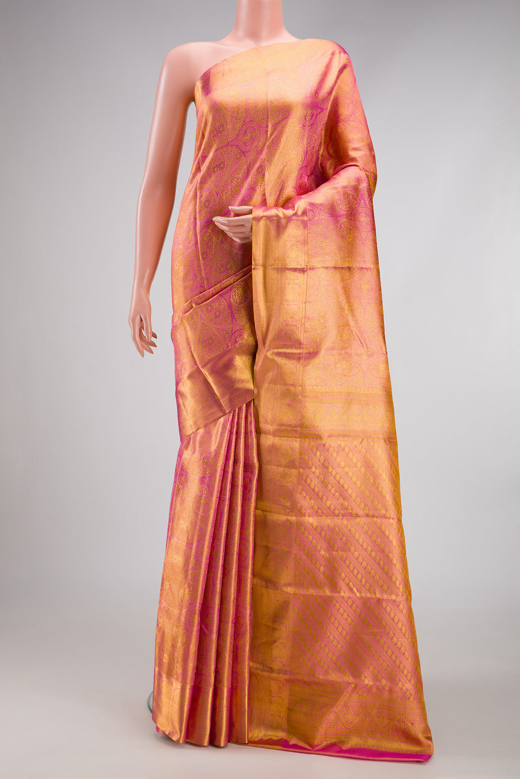 Pink Dual Tone Kanchipuram Tissue Silk Saree with Zari Brocade on the body and Zari Border.  displayed on a mannequin