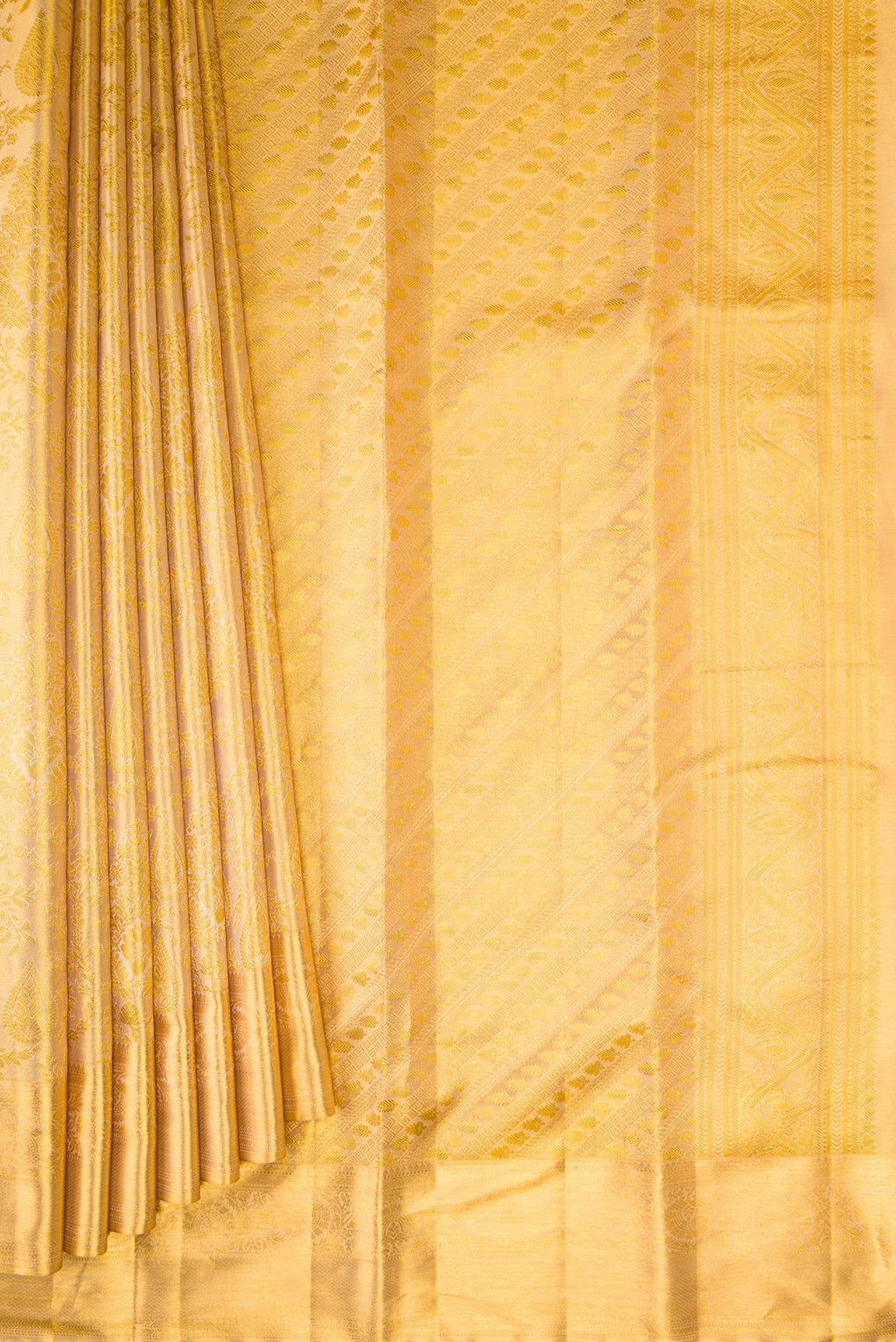 Pleats and pallu of Gold Dual Tone Kanchipuram Tissue Silk Saree with Zari Brocade on the body and Zari Border. 