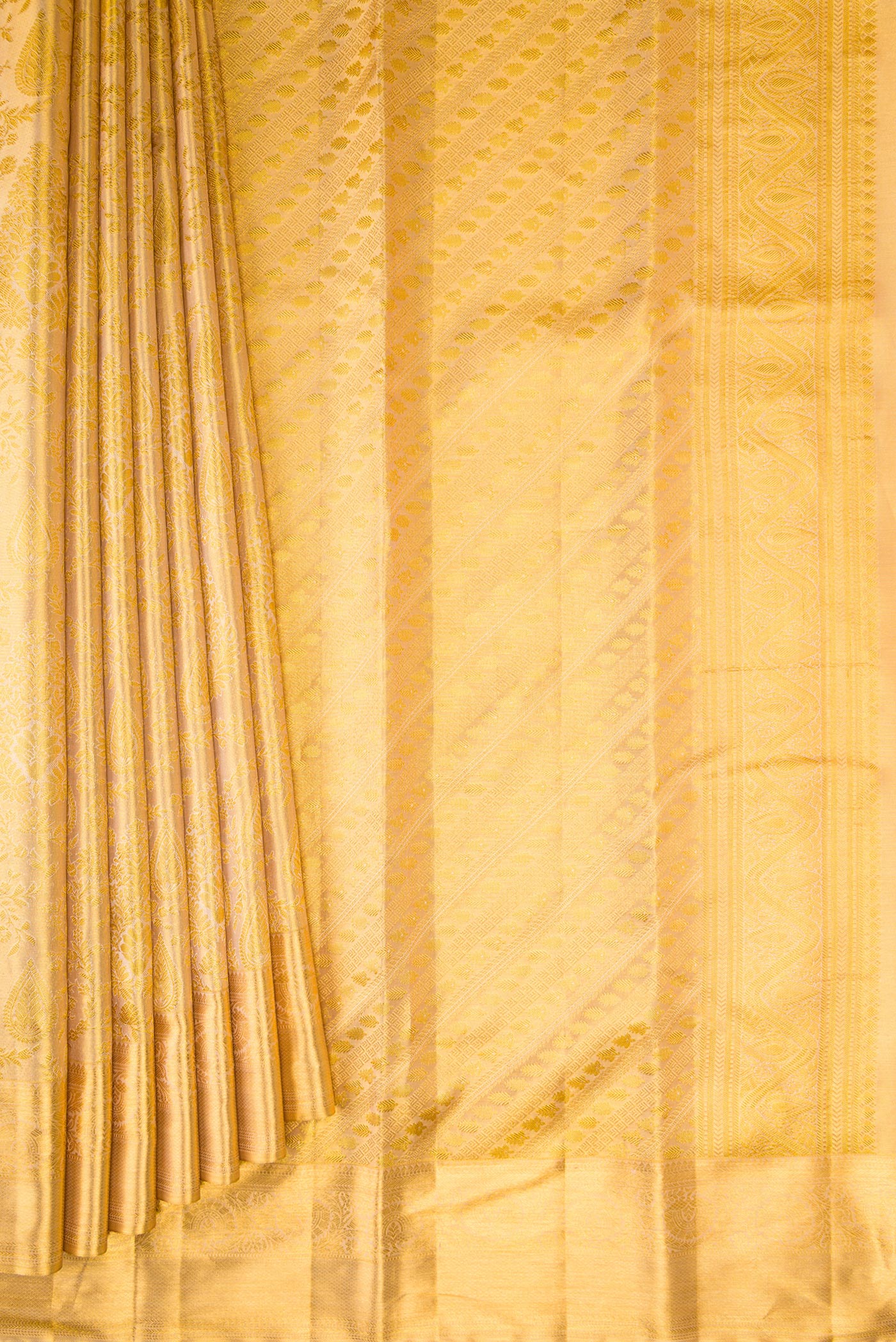 Pleats and pallu of Gold Dual Tone Kanchipuram Tissue Silk Saree with Zari Brocade on the body and Zari Border. 