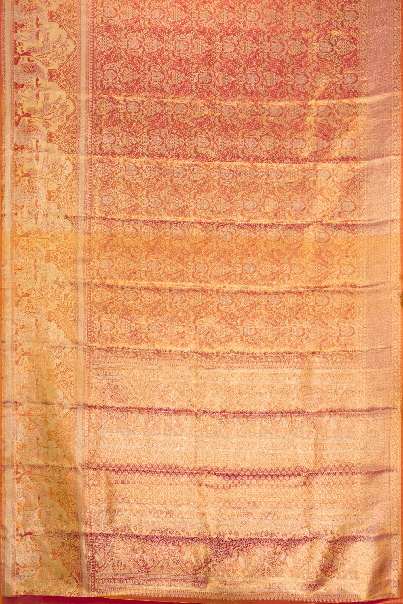 Flat view of Coral Dual Tone Kanjivaram Tissue Silk Saree with Zari Brocade on the body and Fancy Border. 