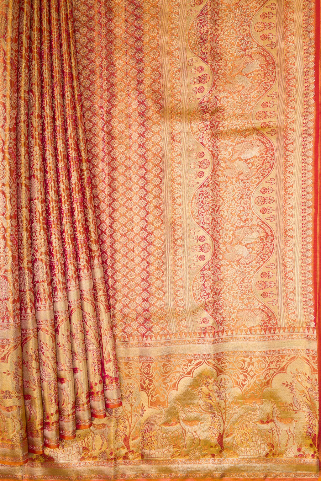 Pleats and pallu of Coral Dual Tone Kanjivaram Tissue Silk Saree with Zari Brocade on the body and Fancy Border. 