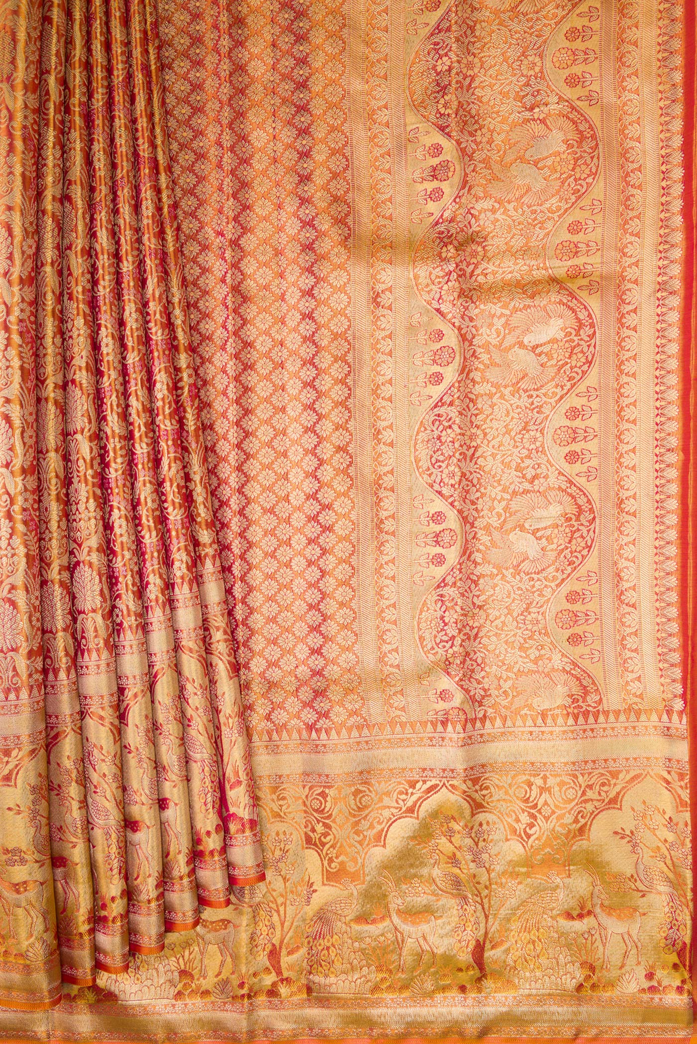 Pleats and pallu of Coral Dual Tone Kanjivaram Tissue Silk Saree with Zari Brocade on the body and Fancy Border. 