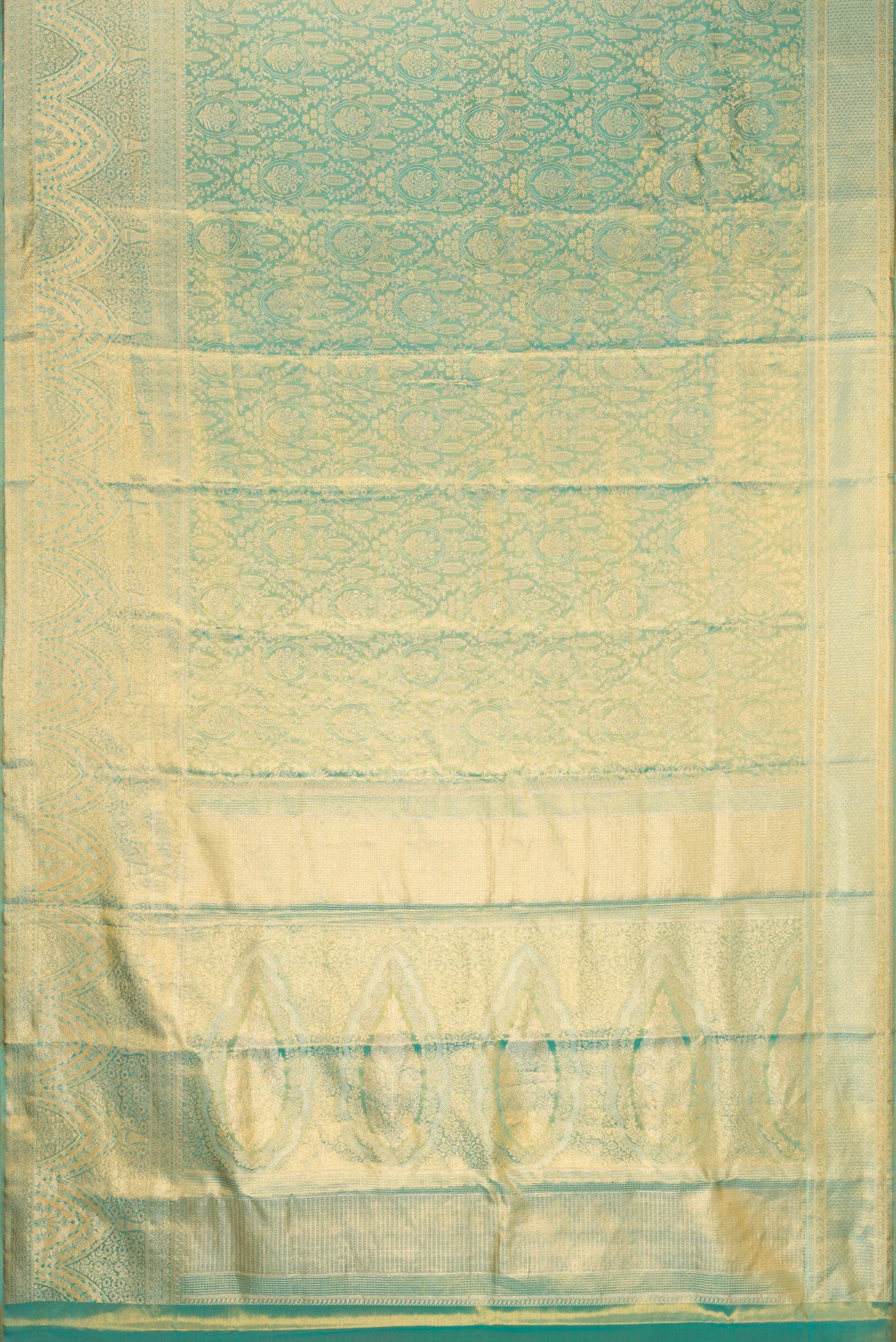 Flat view of Sea Green Dual Tone Kanjivaram Tissue Silk Saree with Zari Brocade on the body and Fancy Border. 
