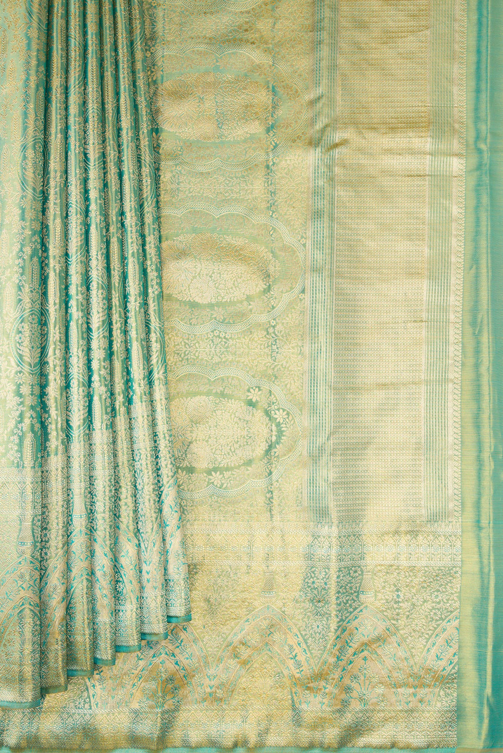 Pleats and pallu of Sea Green Dual Tone Kanjivaram Tissue Silk Saree with Zari Brocade on the body and Fancy Border. 