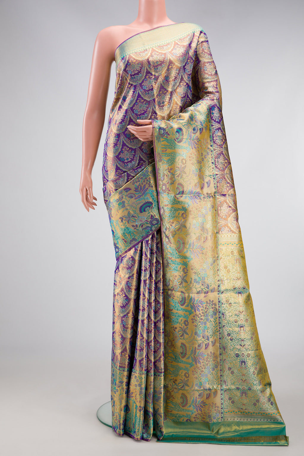 Royal Blue Dual Tone Kanjivaram Tissue Silk Saree with Zari Brocade on the body and Zari Border.  displayed on a mannequin