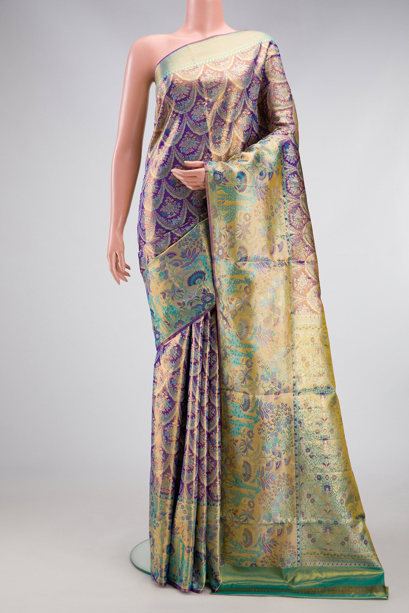 Royal Blue Dual Tone Kanjivaram Tissue Silk Saree with Zari Brocade on the body and Zari Border.  displayed on a mannequin