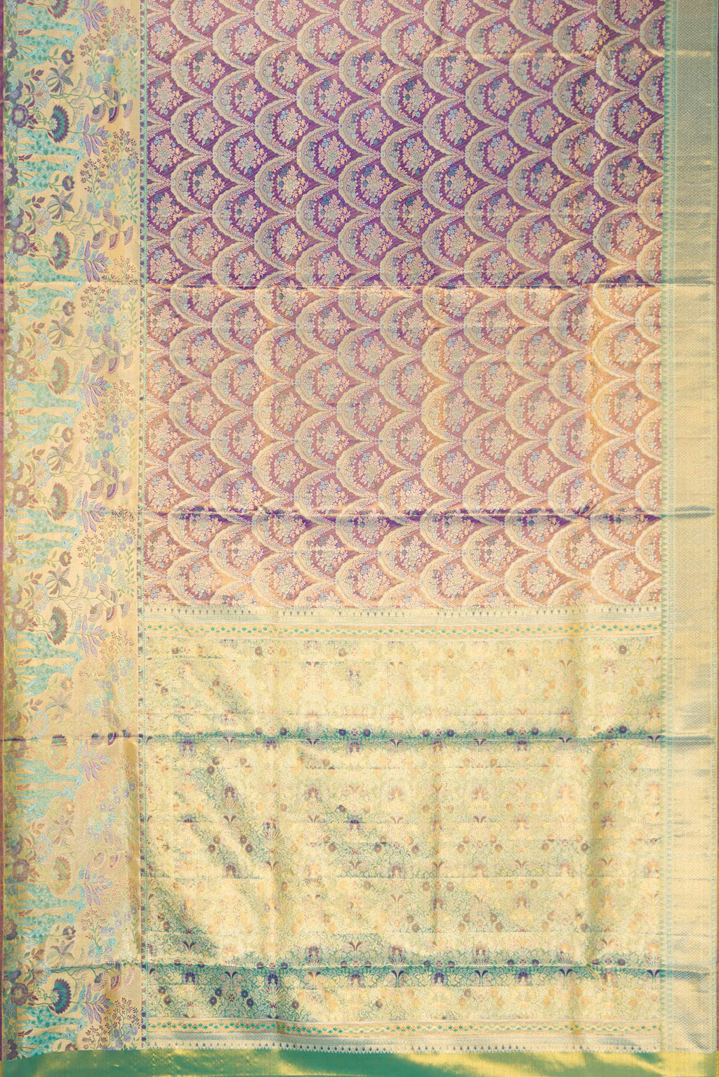 Flat view of Royal Blue Dual Tone Kanjivaram Tissue Silk Saree with Zari Brocade on the body and Zari Border. 
