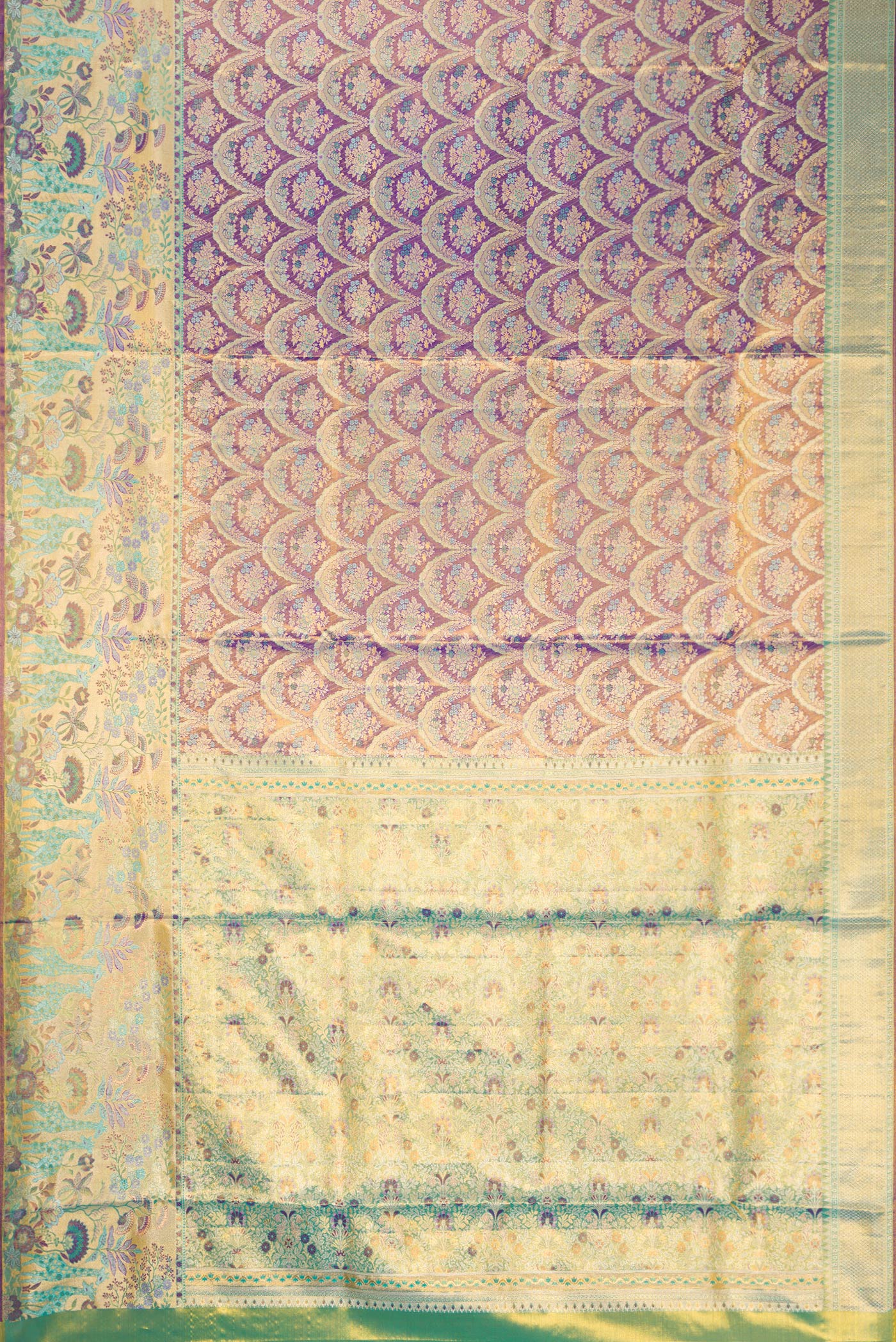 Flat view of Royal Blue Dual Tone Kanjivaram Tissue Silk Saree with Zari Brocade on the body and Zari Border. 