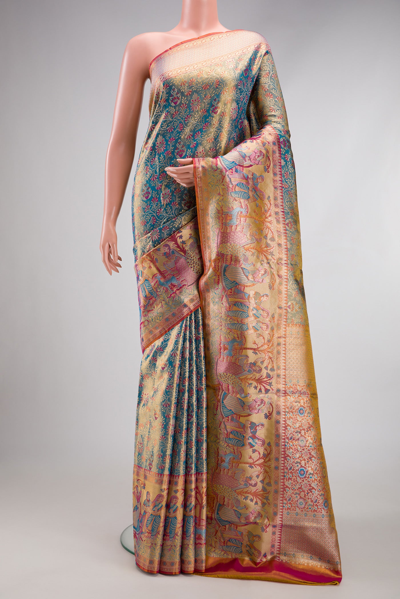Blue Dual Tone Kanjivaram Tissue Silk Saree with Zari Brocade on the body and Fancy Border.  displayed on a mannequin