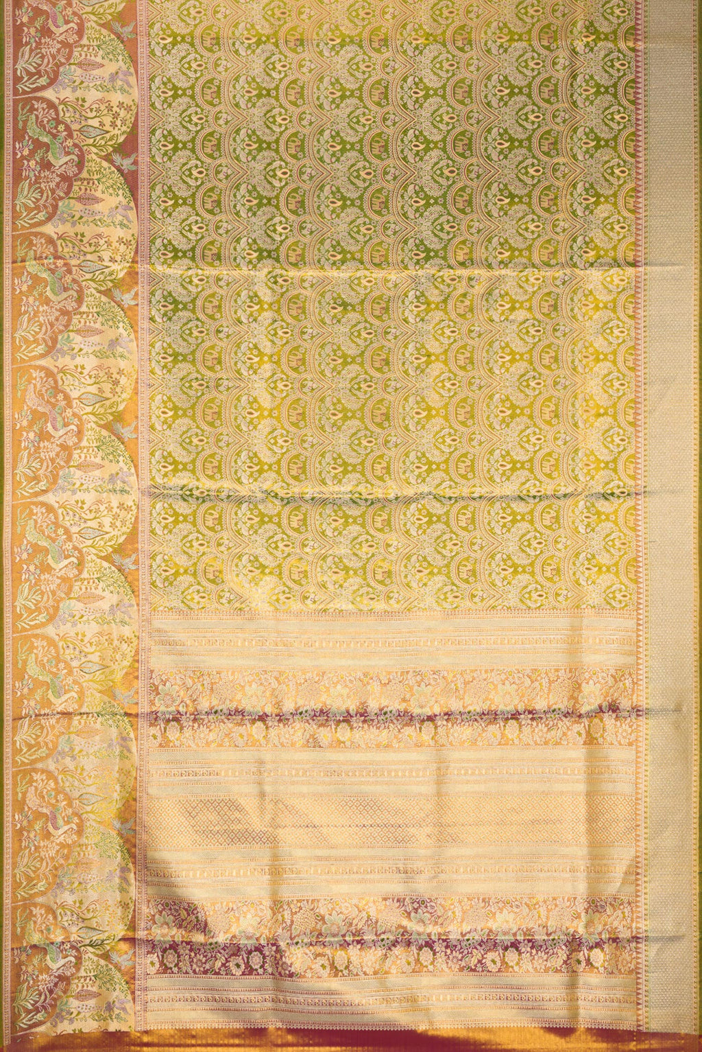 Flat view of Green Dual Tone Kanjivaram Tissue Silk Saree with Zari Brocade on the body and Fancy Border. 