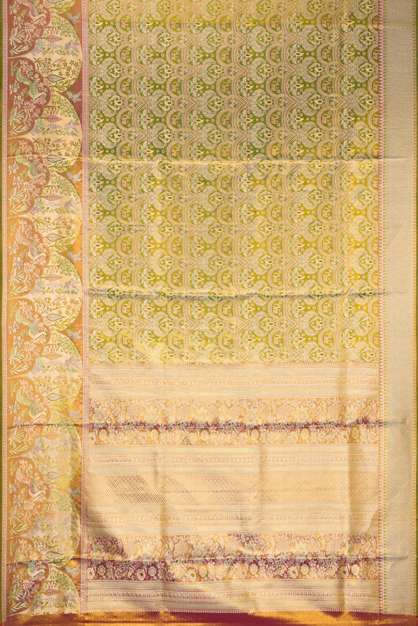 Flat view of Green Dual Tone Kanjivaram Tissue Silk Saree with Zari Brocade on the body and Fancy Border. 