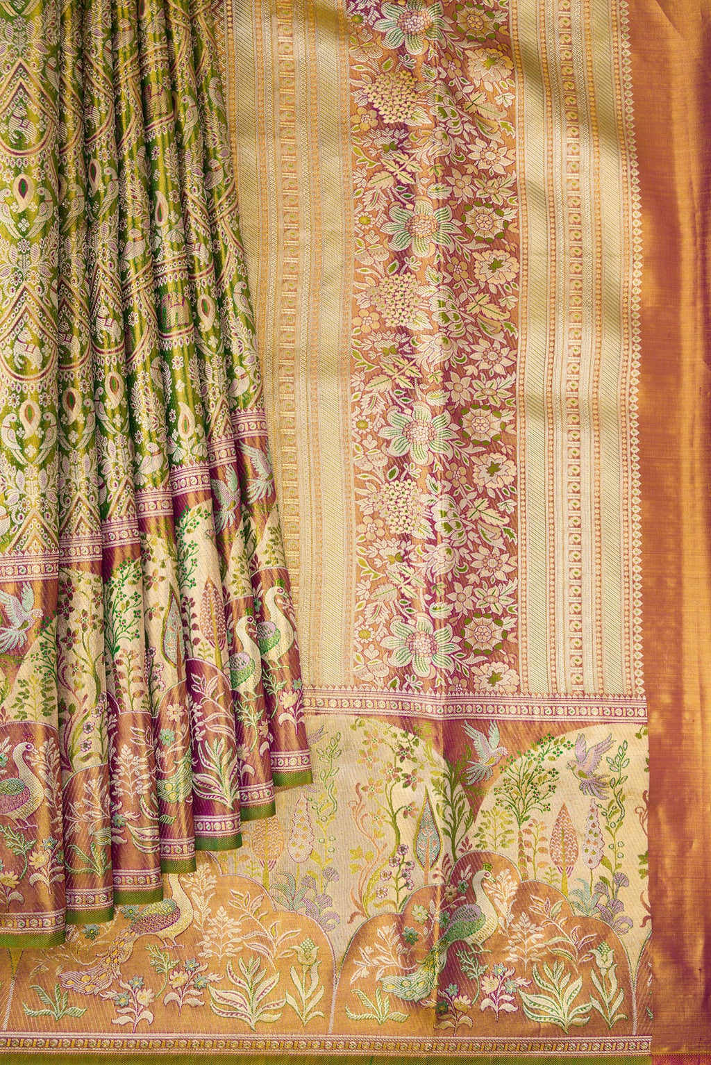 Pleats and pallu of Green Dual Tone Kanjivaram Tissue Silk Saree with Zari Brocade on the body and Fancy Border. 