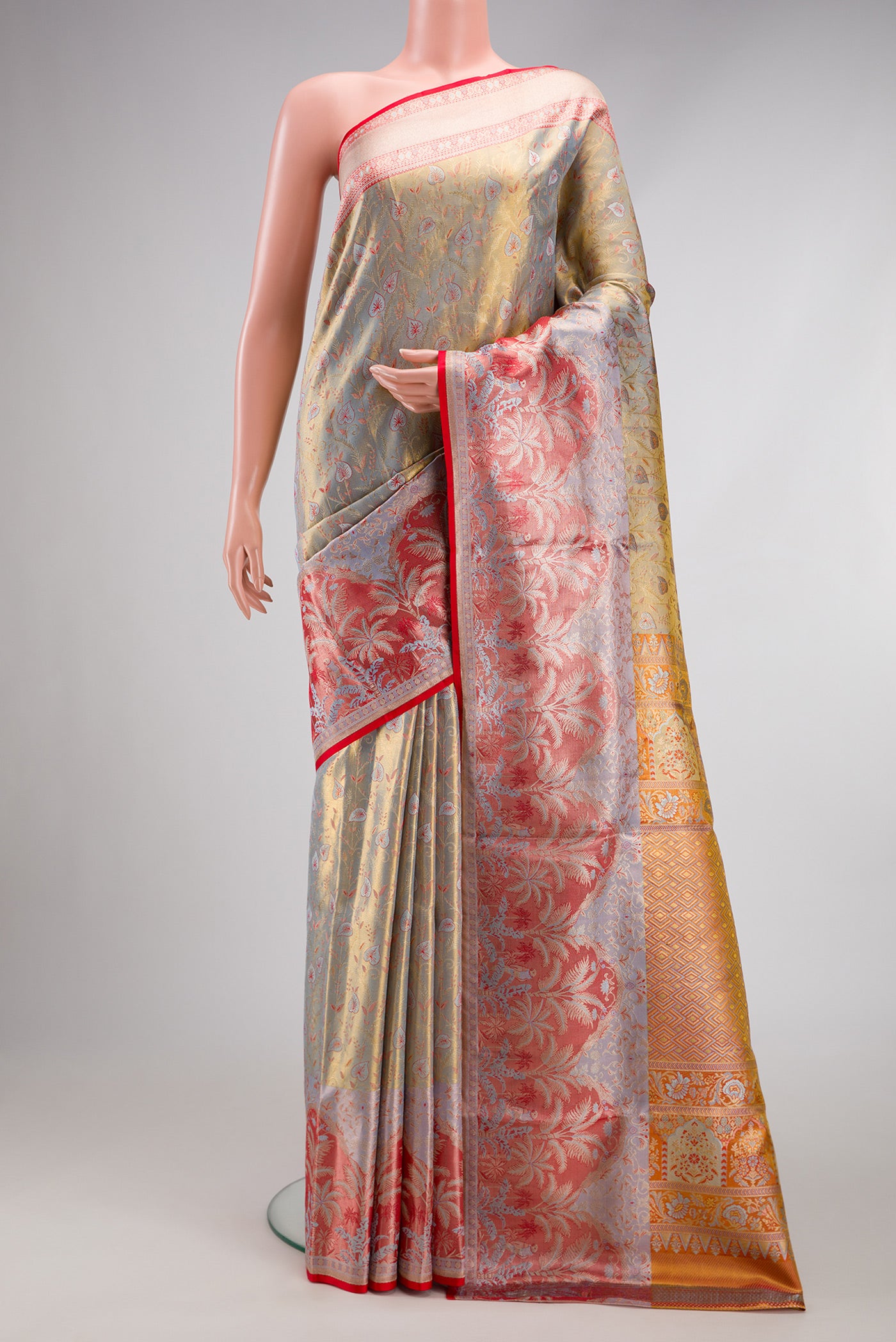 Light Green Dual Tone Kanjivaram Tissue Silk Saree with Zari Brocade on the body and Fancy Border.  displayed on a mannequin