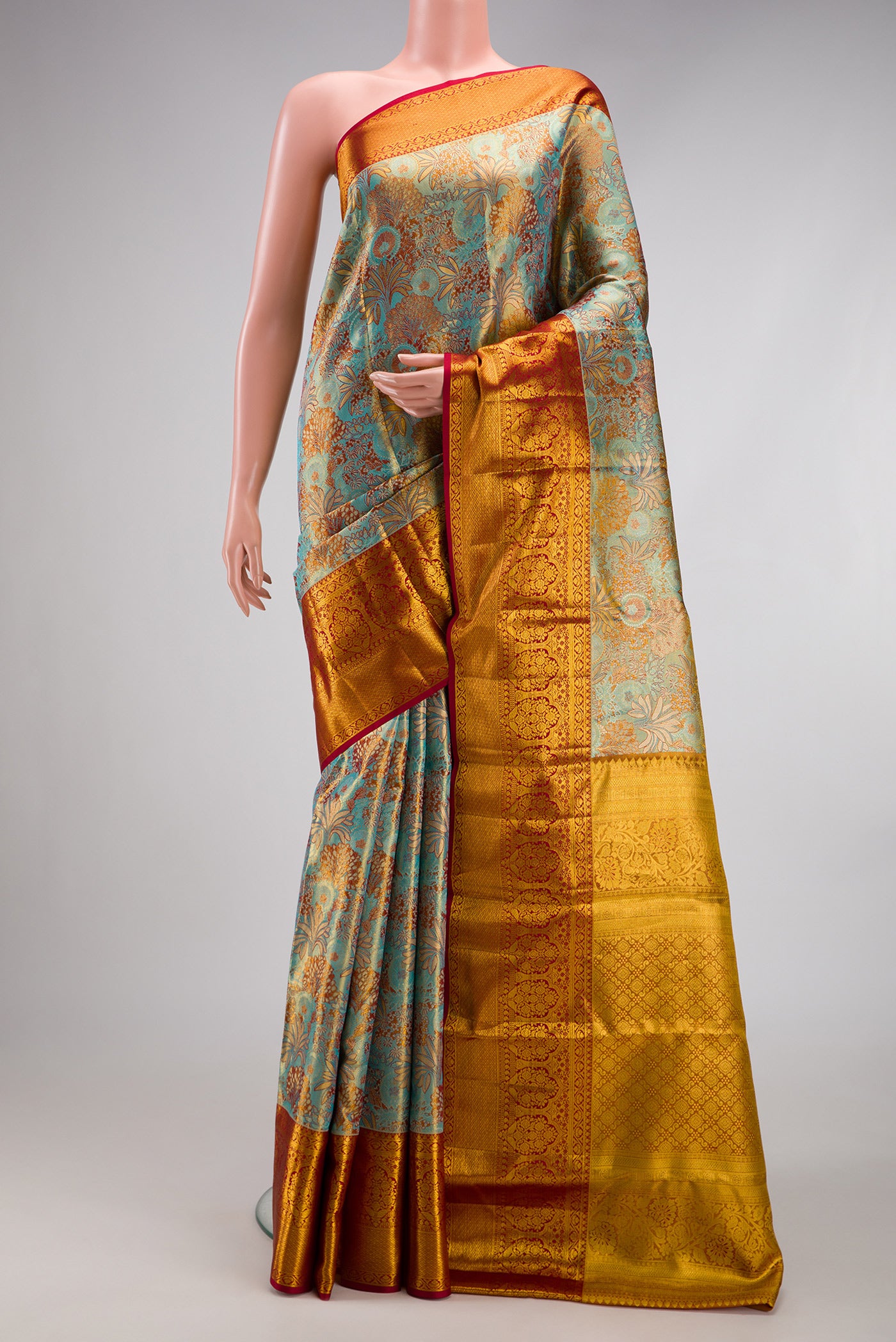Blue Dual Tone Kanjivaram Tissue Silk Saree with Zari Brocade on the body and Zari Border.  displayed on a mannequin