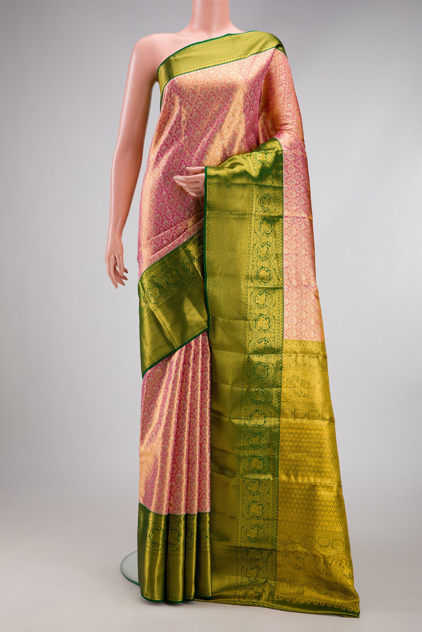 Pink Dual Tone Kanjivaram Tissue Silk Saree with Zari Brocade on the body and Zari Border.  displayed on a mannequin