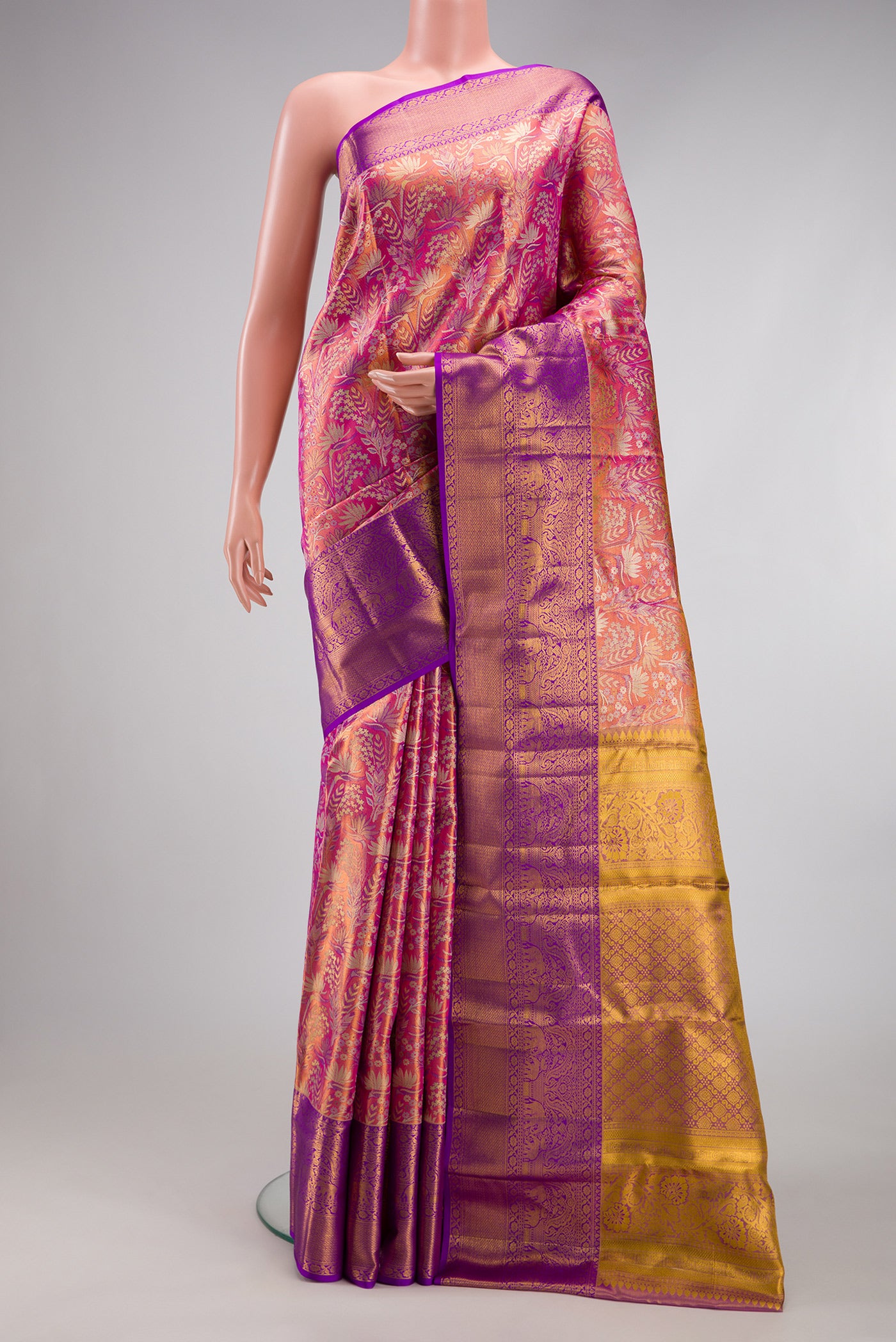 Pink Dual Tone Kanjivaram Tissue Silk Saree with Zari Brocade on the body and Zari Border.  displayed on a mannequin