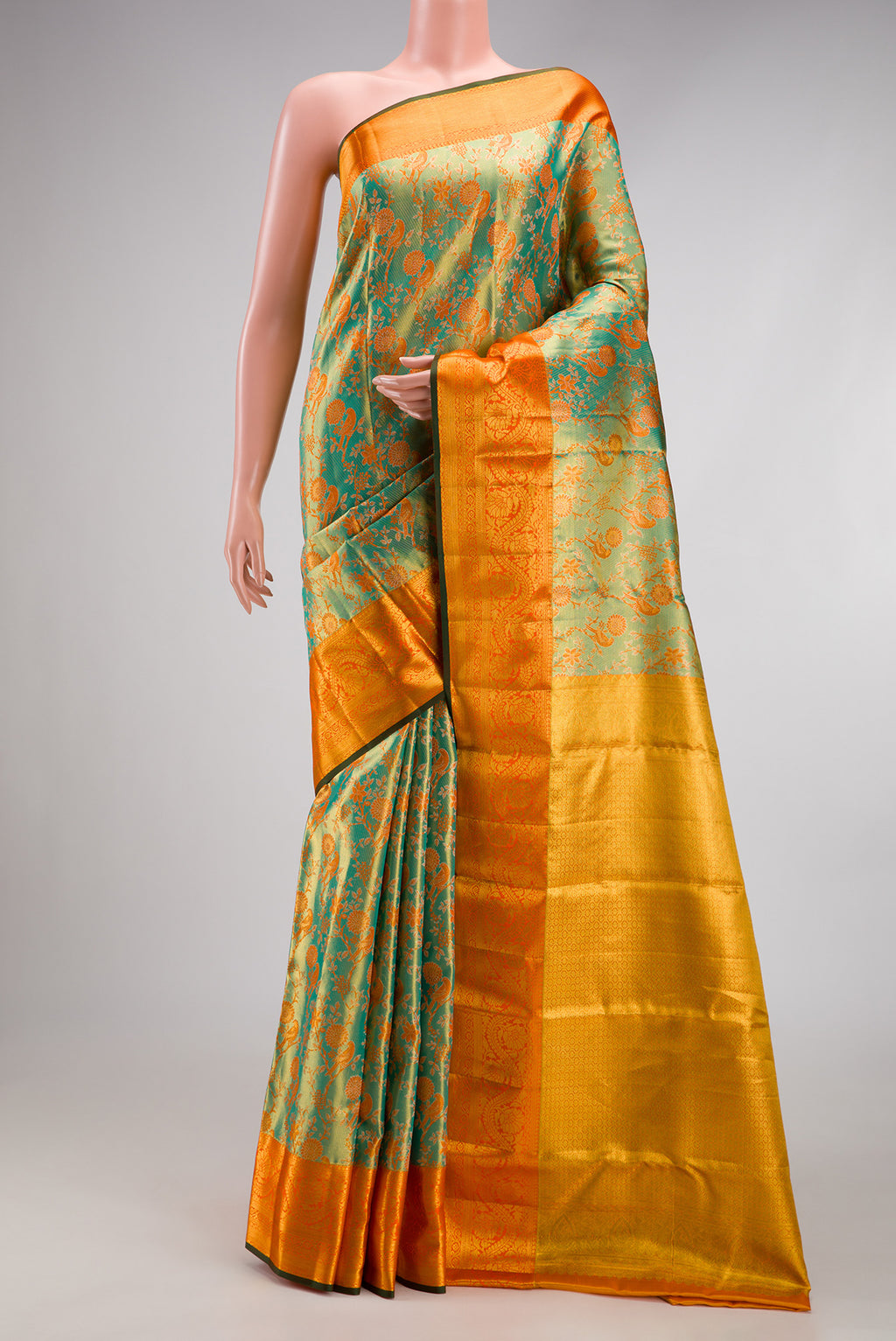 Sea Green Dual Tone Kanjivaram Tissue Silk Saree with Zari Brocade on the body and Zari Border.  displayed on a mannequin