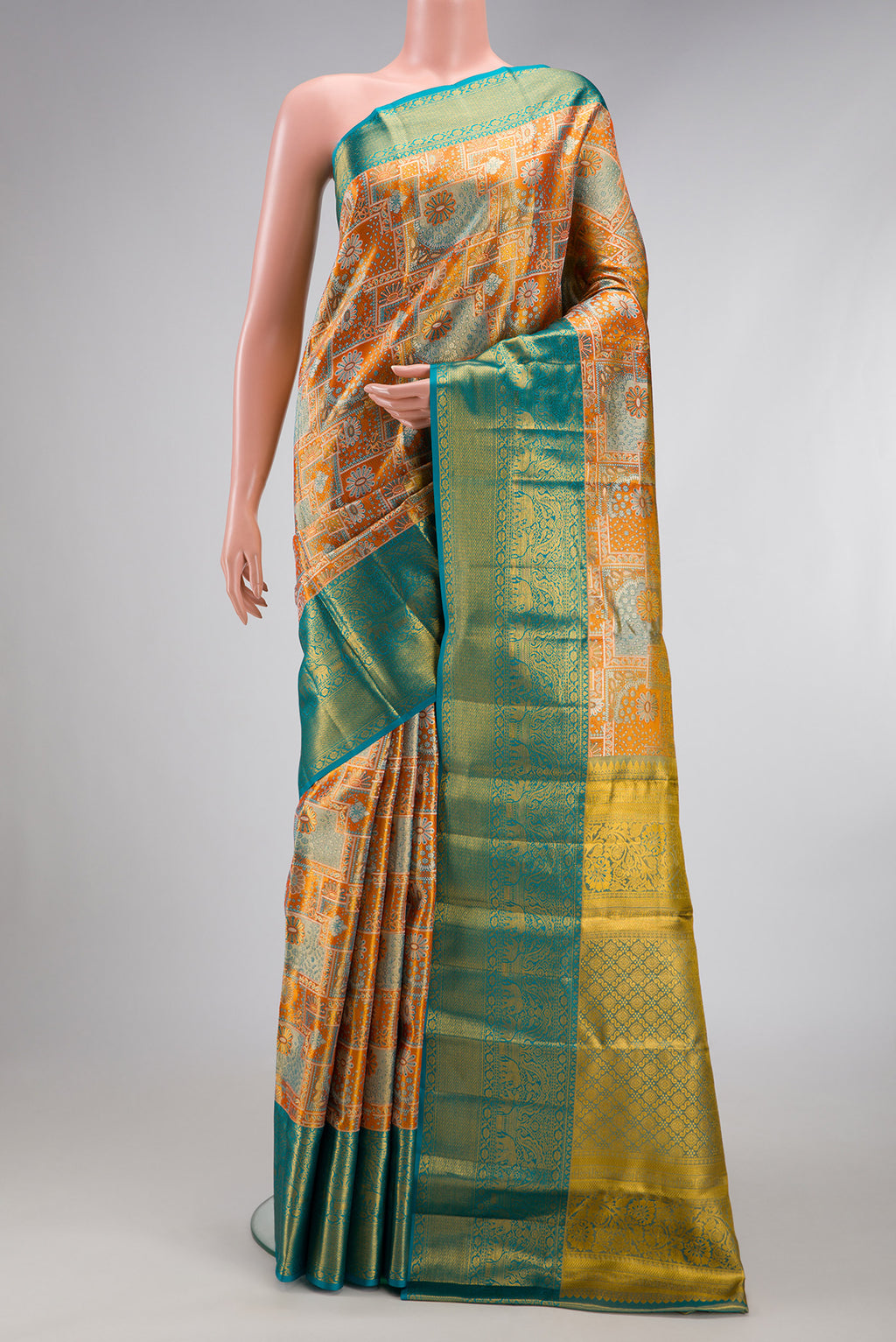 Orange Dual Tone Kanjivaram Tissue Silk Saree with Zari Brocade on the body and Zari Border.  displayed on a mannequin