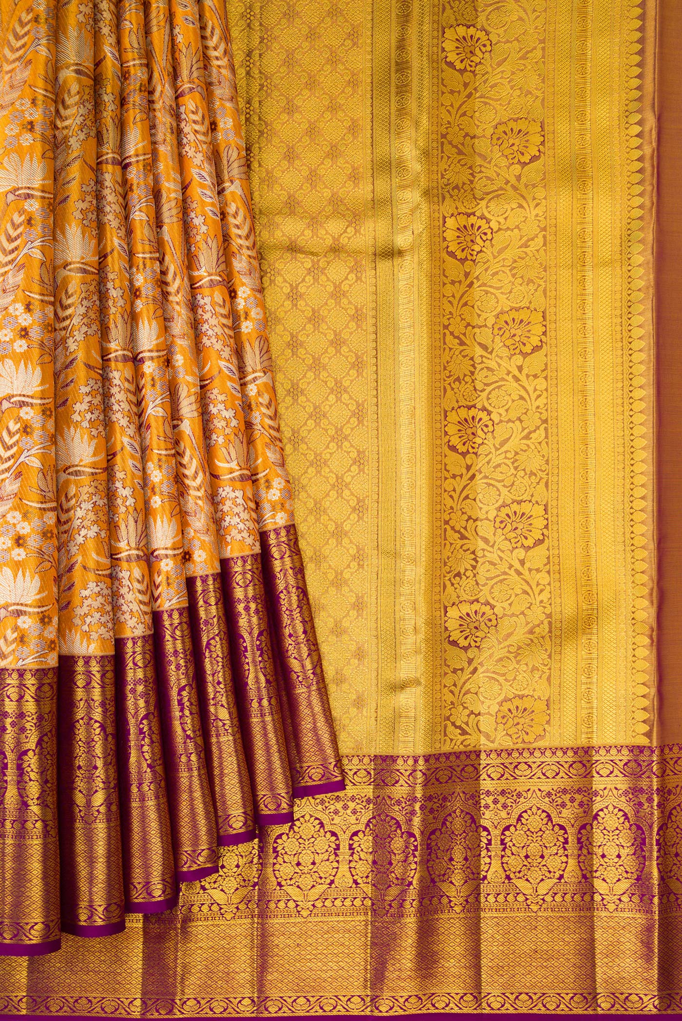 Pleats and pallu of Mustard Dual Tone Kanjivaram Tissue Silk Saree with Zari Brocade on the body and Zari Border. 