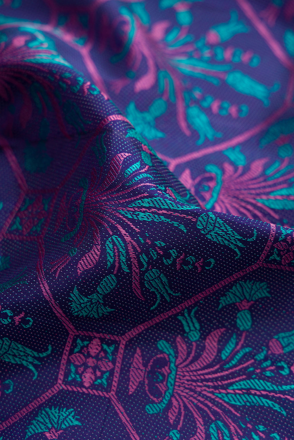 Close up of Navy Blue Kanchipuram Silk Saree with Jacquard design on the body and Fancy Border.  displaying folds
