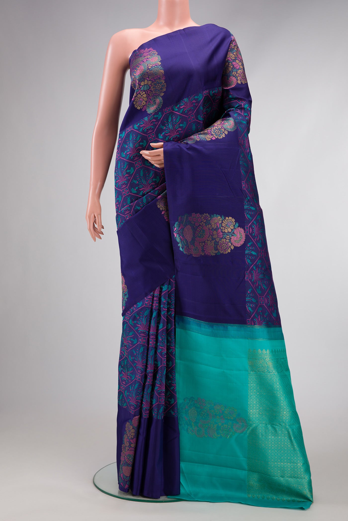 Navy Blue Kanchipuram Silk Saree with Jacquard design on the body and Fancy Border.  displayed on a mannequin