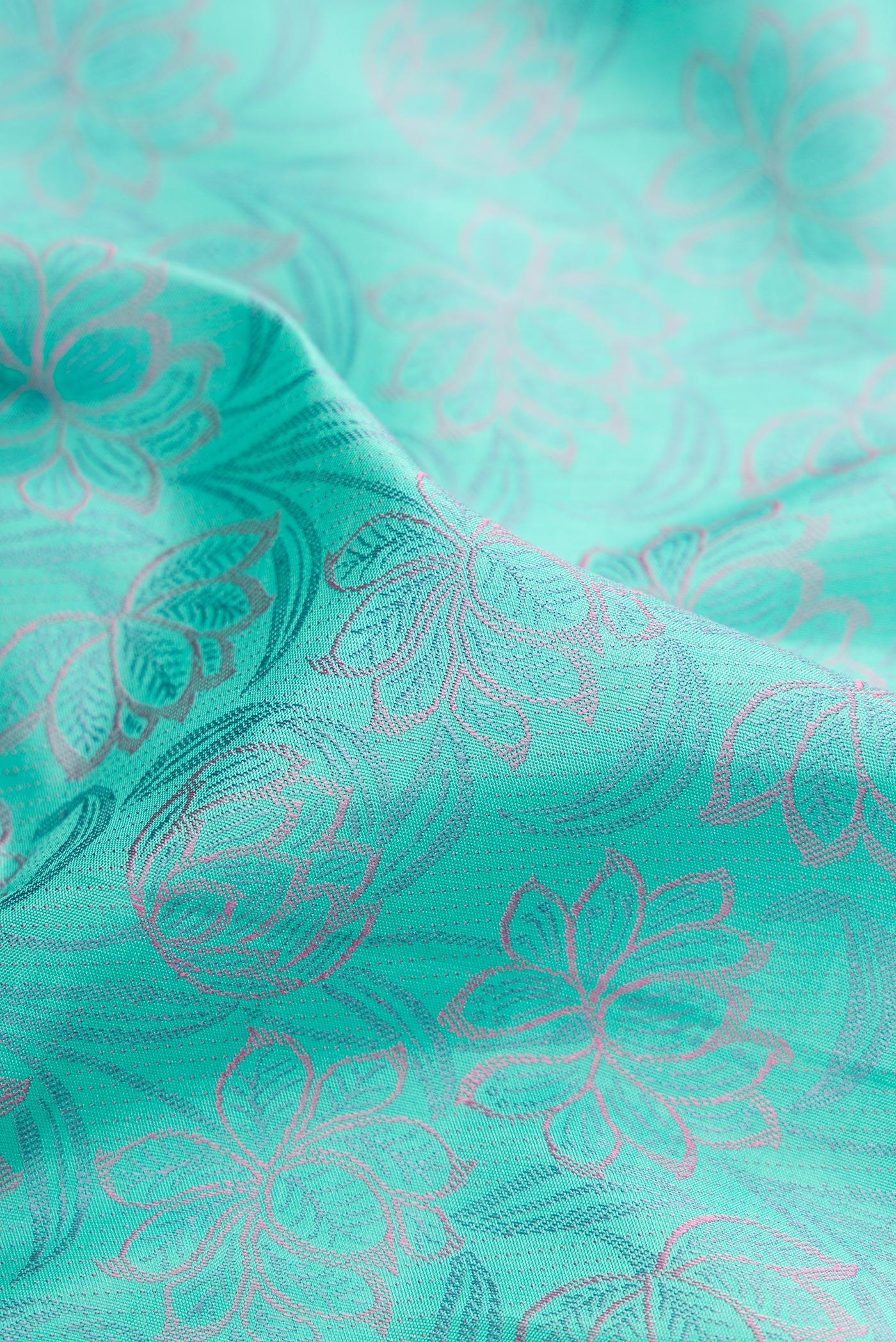 Close up of Sea Green Dual Tone Kanchipuram Silk Saree with Jacquard design on the body and Fancy Border.  displaying folds
