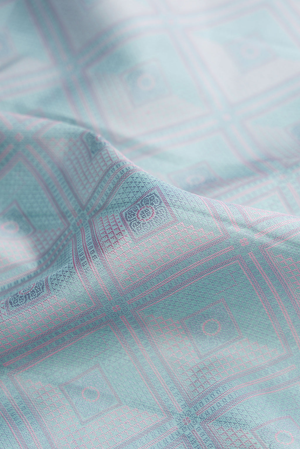 Close up of Light Blue Dual Tone Kanchipuram Silk Saree with Jacquard design on the body and Fancy Border.  displaying folds