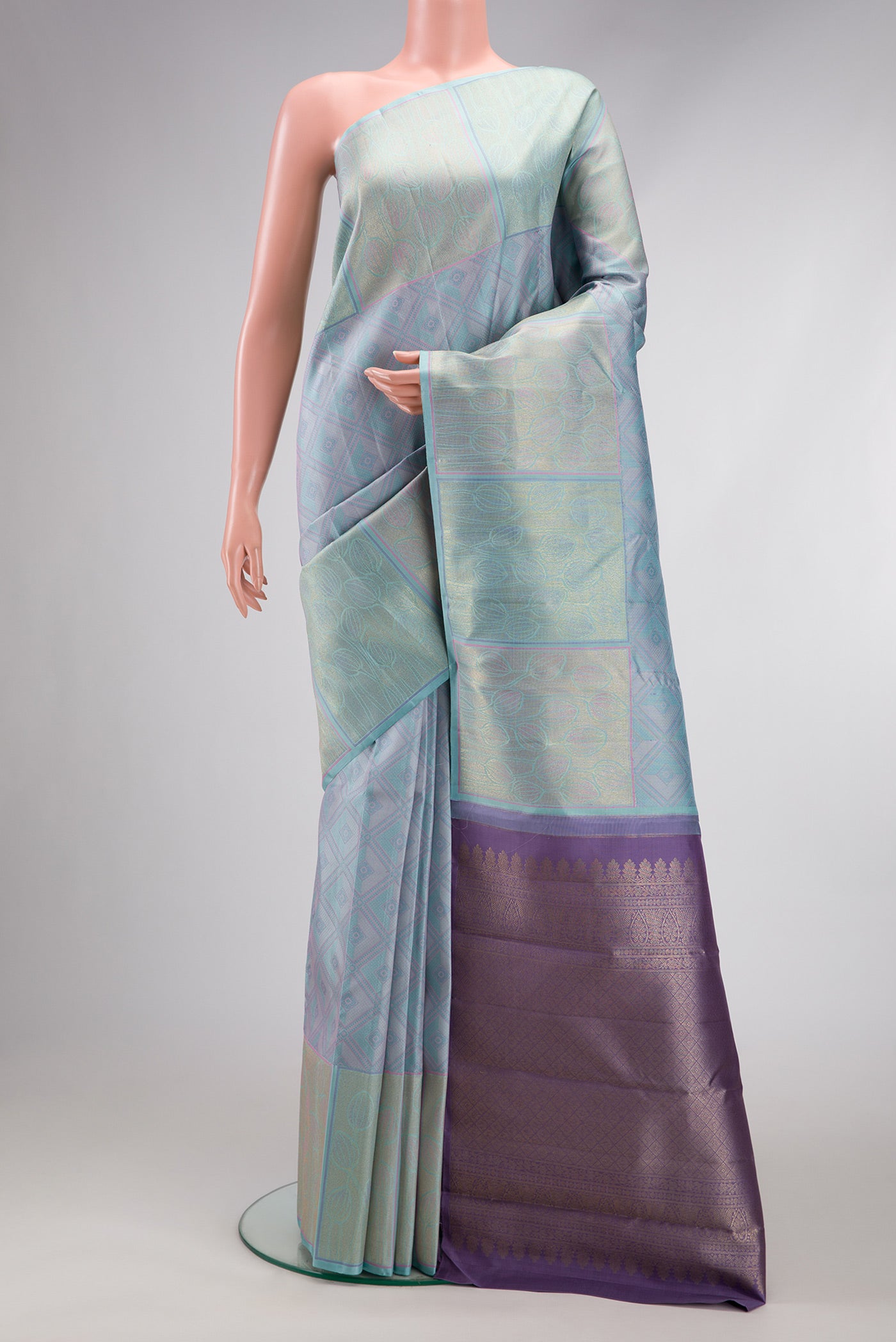 Light Blue Dual Tone Kanchipuram Silk Saree with Jacquard design on the body and Fancy Border.  displayed on a mannequin