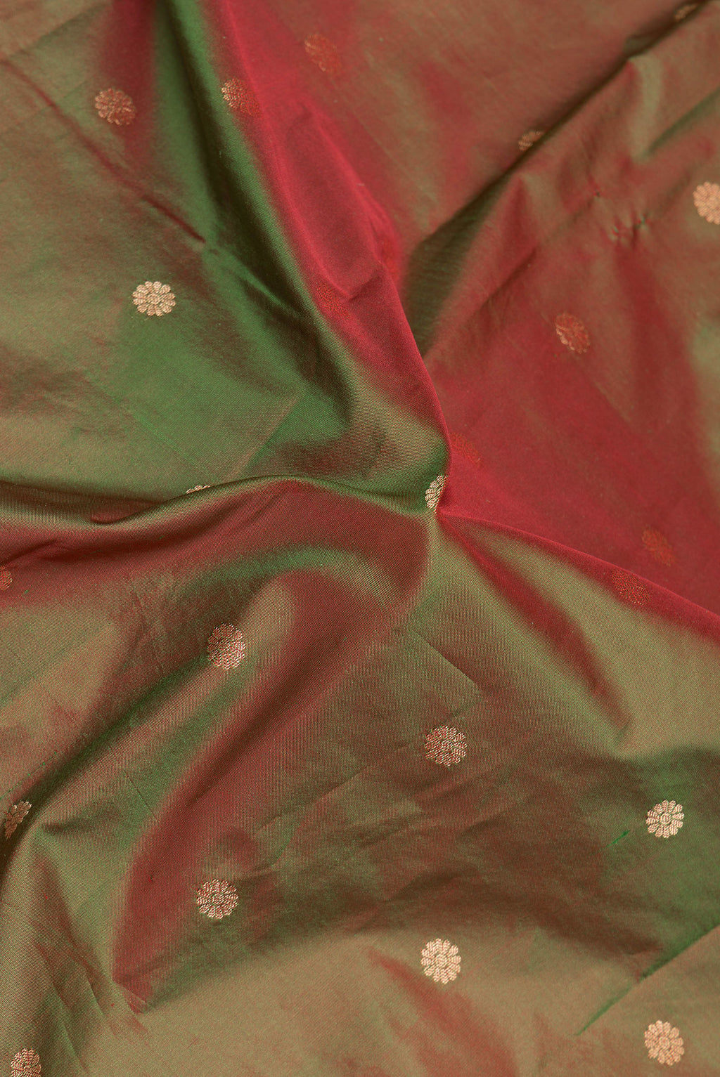Close up of Mehandi Green Dual Tone Paithani Silk Saree with Zari Butta on the body and Zari Border.  displaying folds