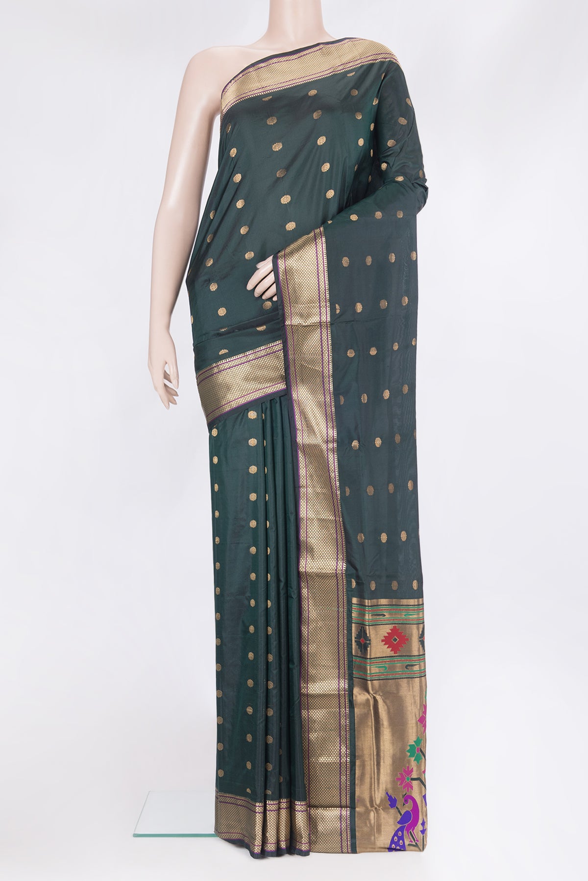 Bottle Green Paithani Silk Saree with Zari Butta on the body and Zari Border.  displayed on a mannequin