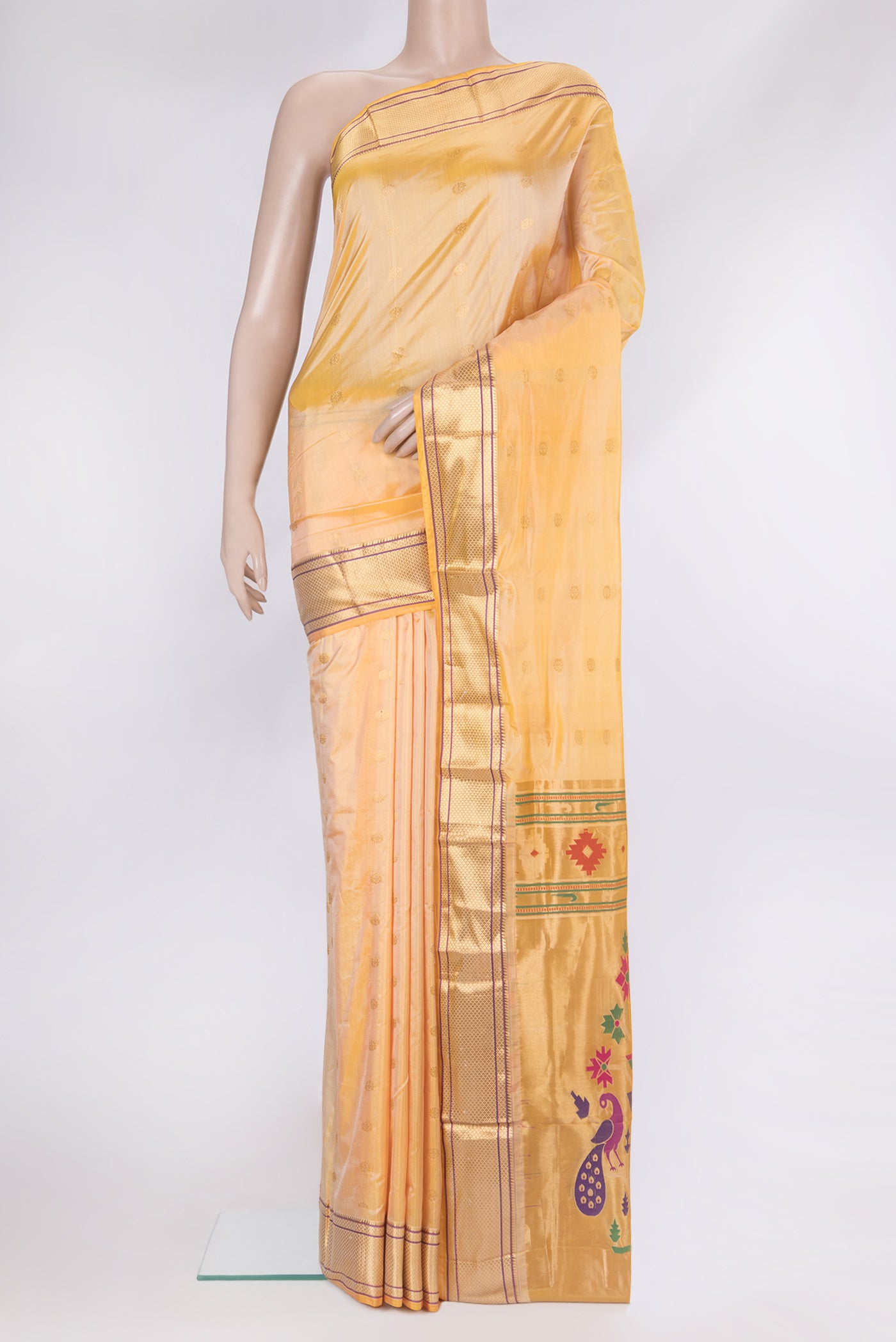 Sandal Paithani Silk Saree with Zari Butta on the body and Zari Border.  displayed on a mannequin