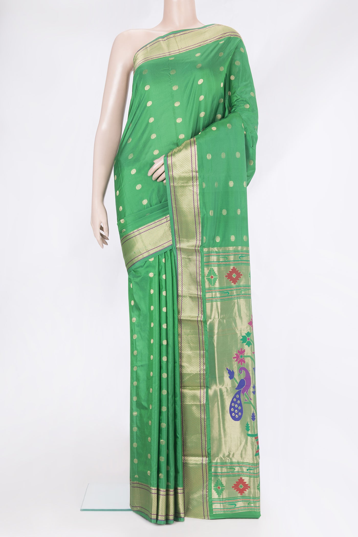 Green Paithani Silk Saree with Zari Butta on the body and Zari Border.  displayed on a mannequin