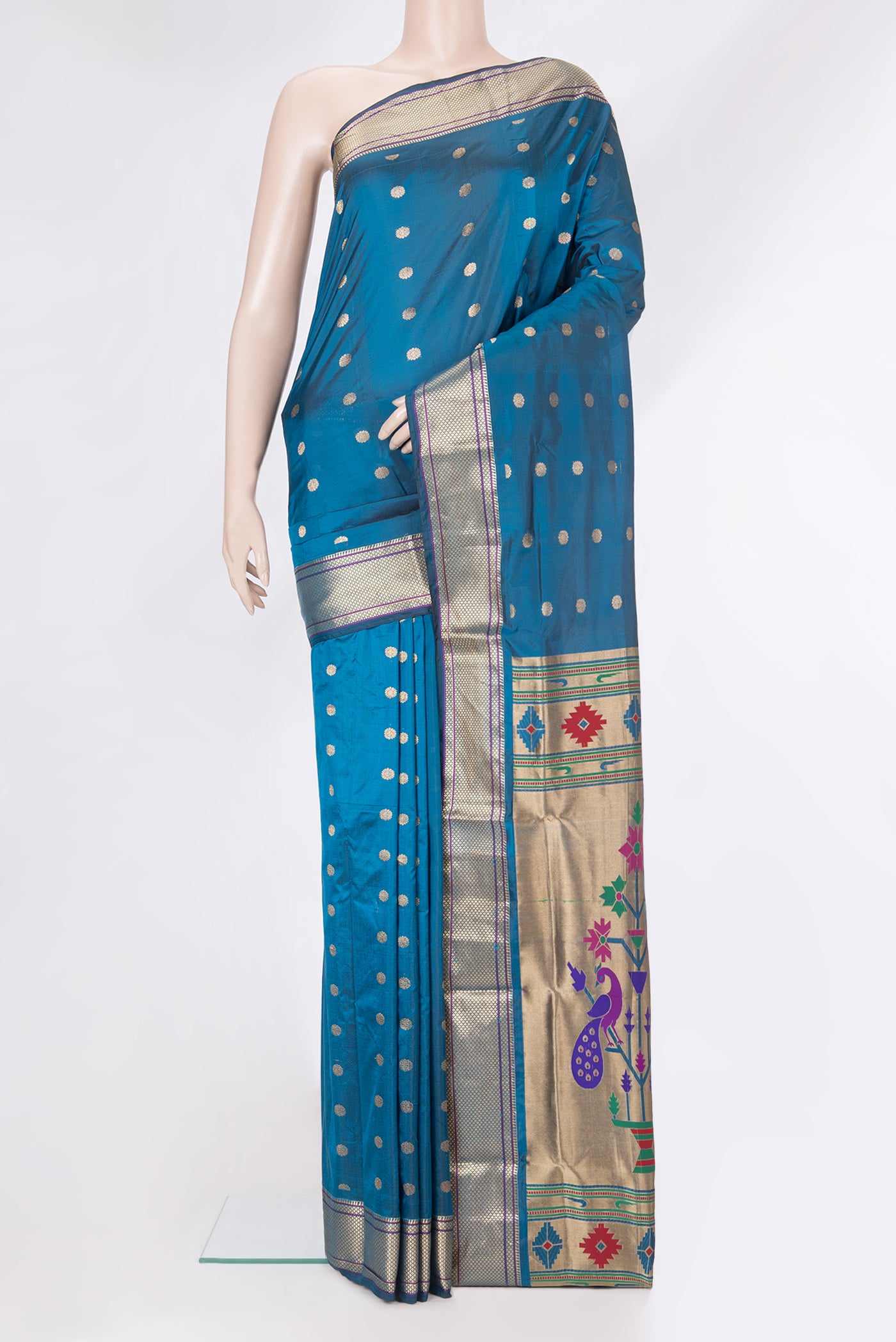 Peacock Blue Blended Paithani Silk Saree with Zari Butta on the body and Zari Border.  displayed on a mannequin