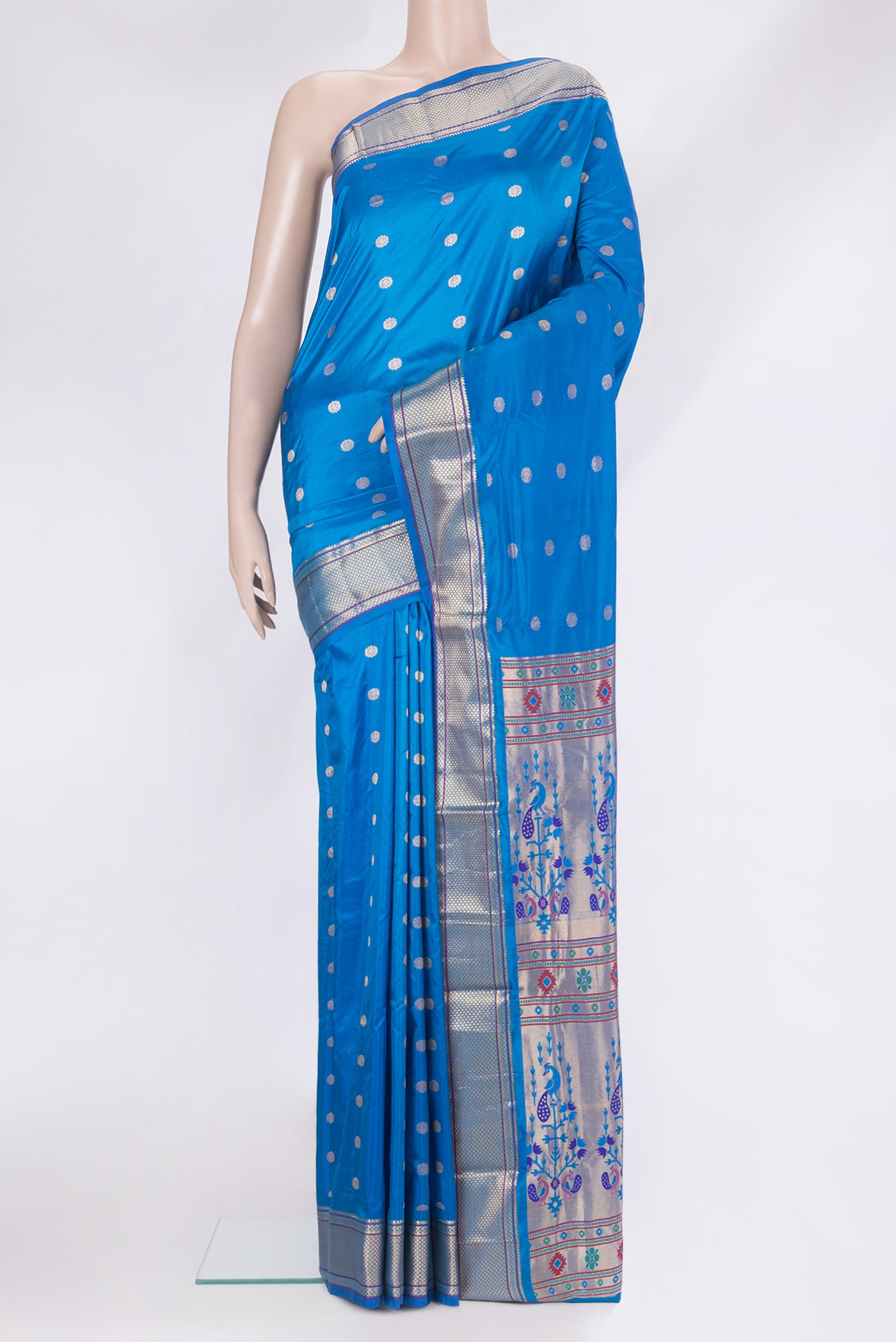 Royal Blue Paithani Silk Saree with Zari Butta on the body and Zari Border.  displayed on a mannequin