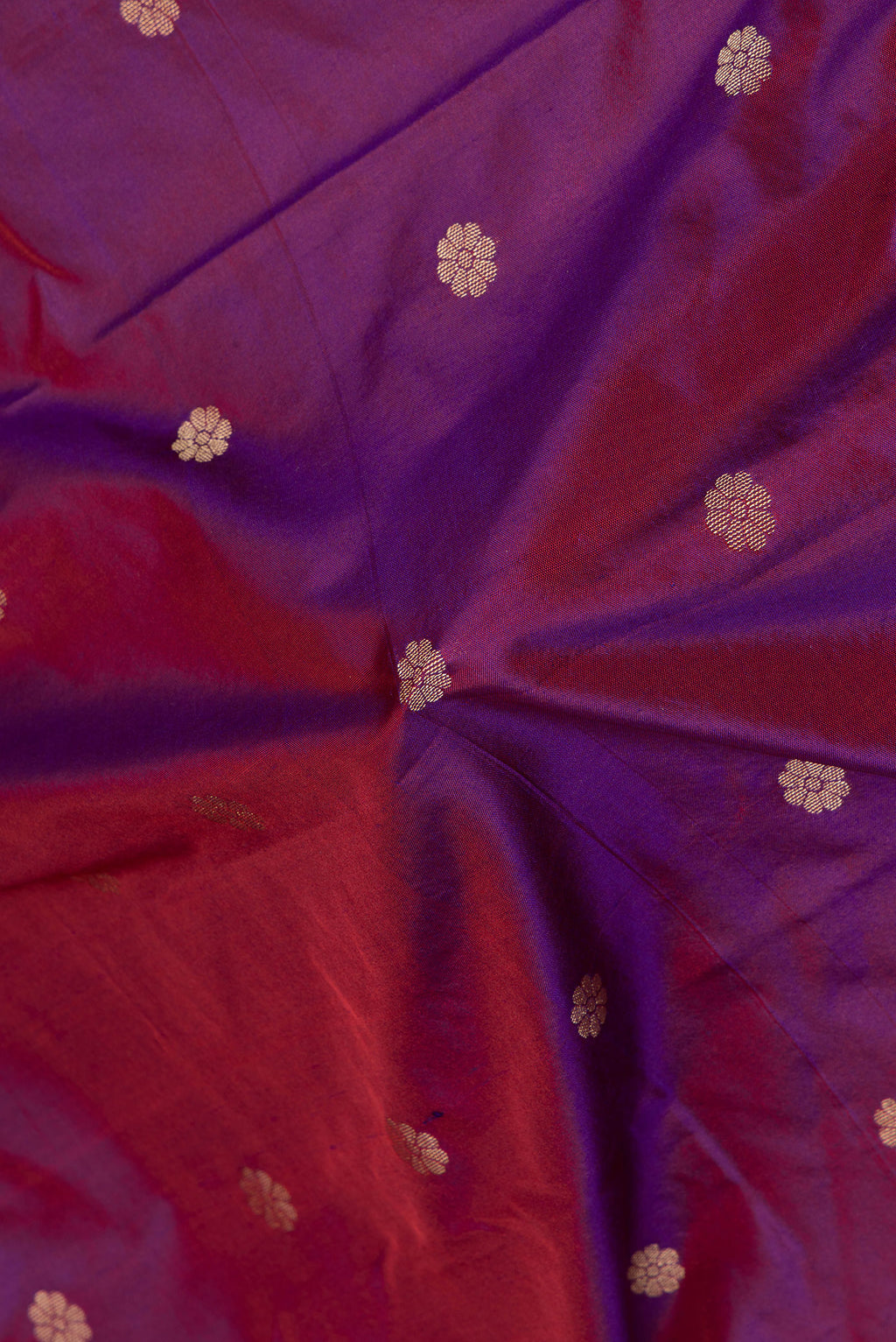 Close up of Purple Paithani Silk Saree with Zari Butta on the body and Zari Border.  displaying folds
