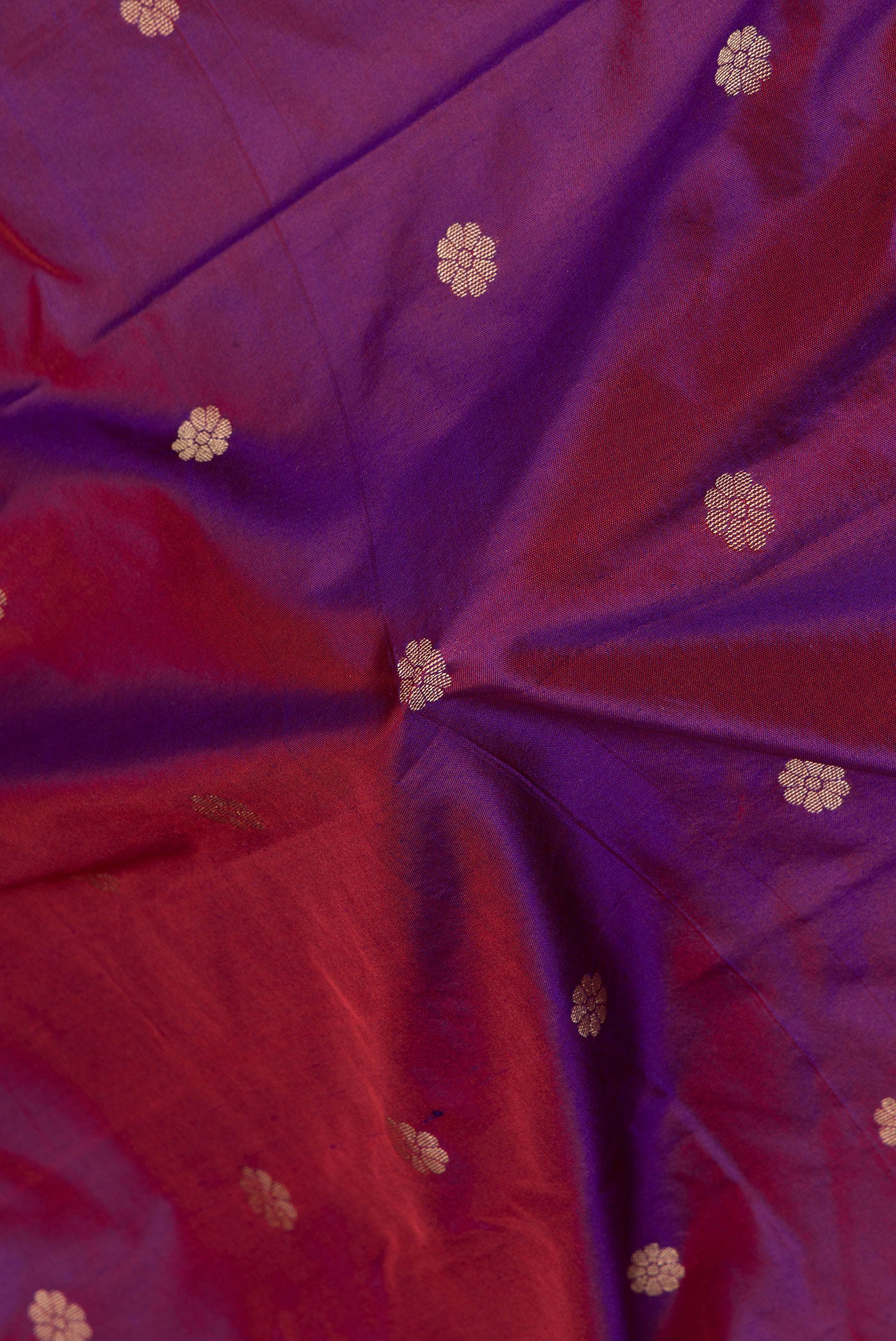 Close up of Purple Paithani Silk Saree with Zari Butta on the body and Zari Border.  displaying folds